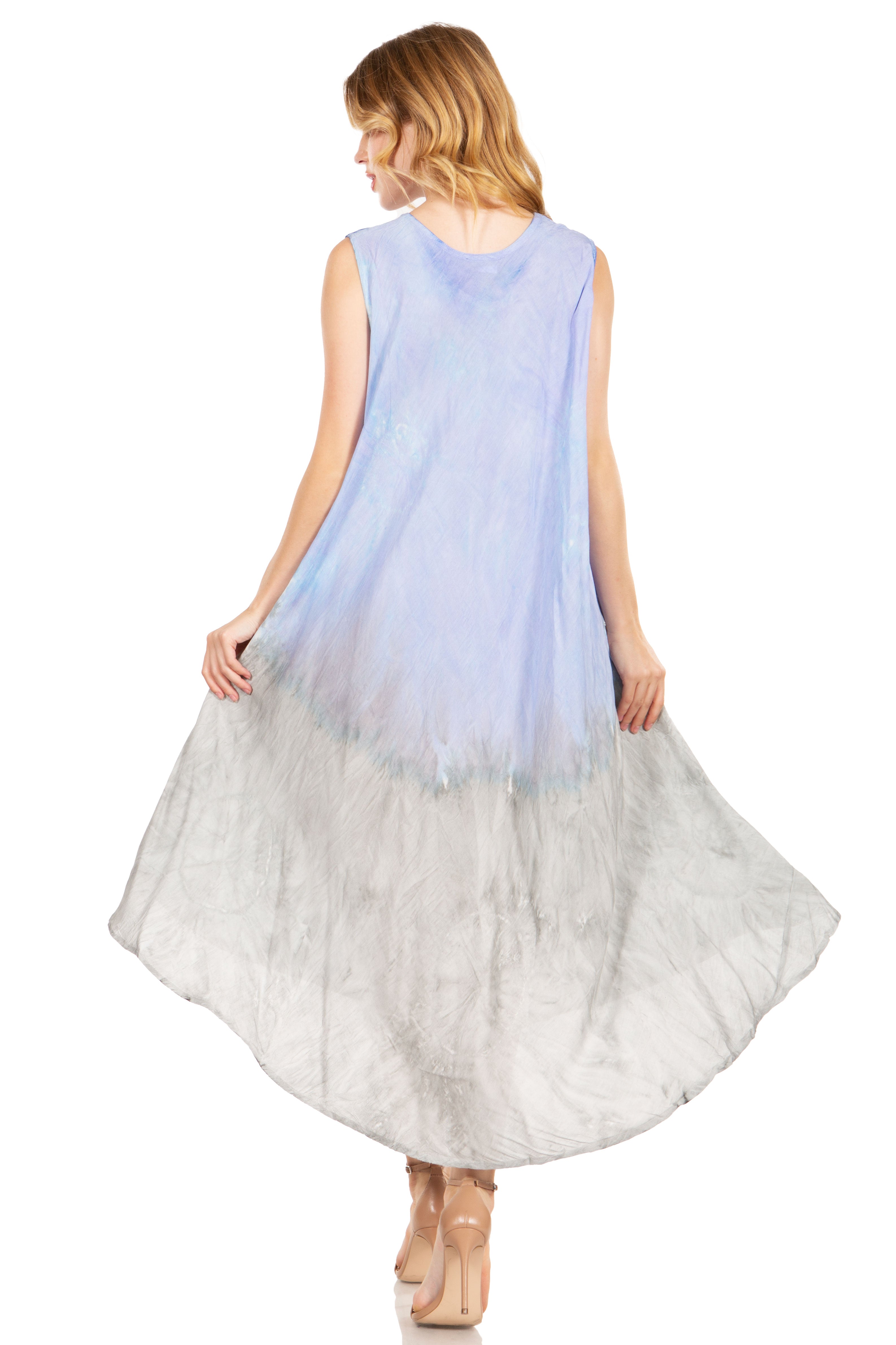 Woman wearing a sleeveless dress with a gradient from light blue to white on a white background