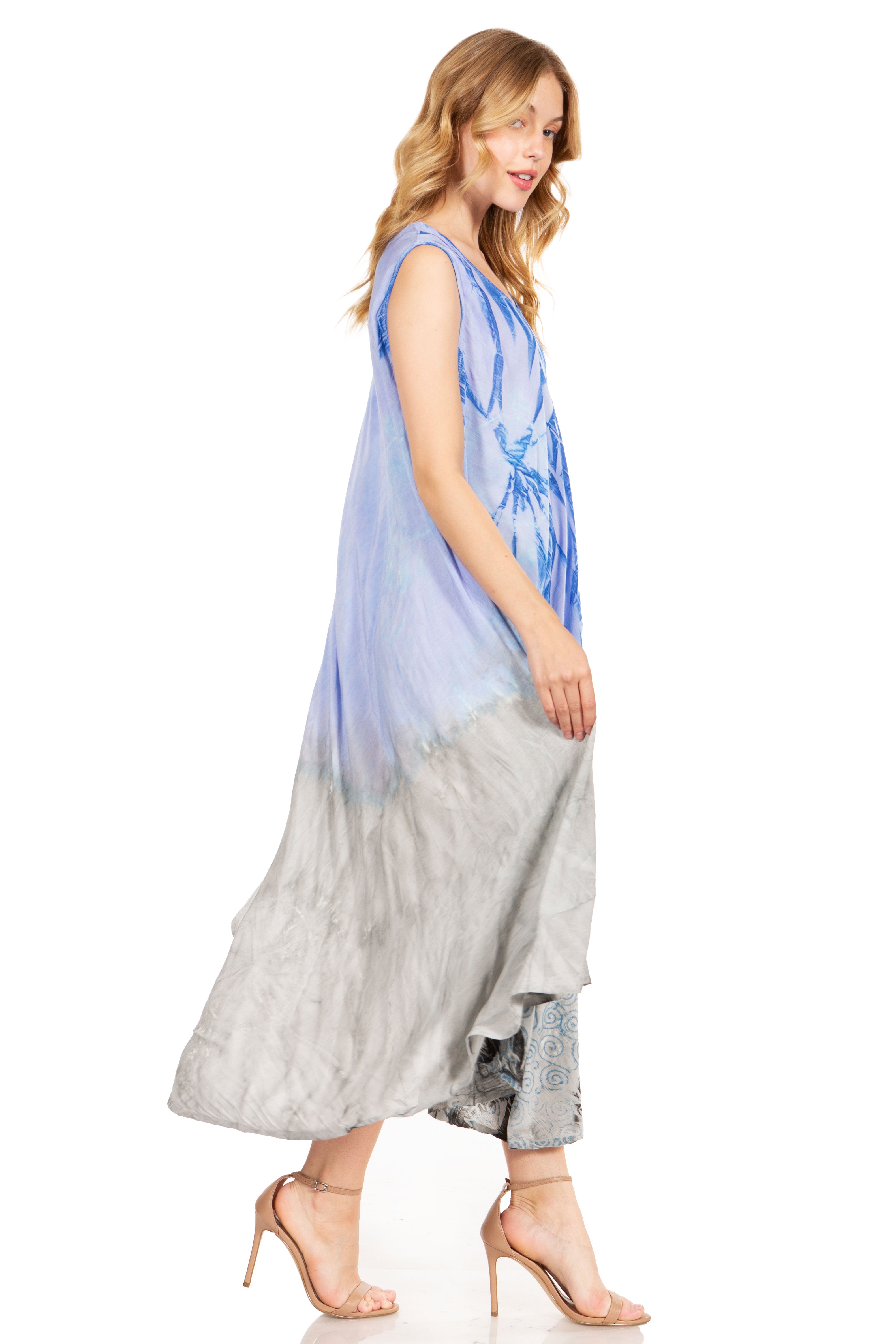 Woman wearing a blue and gray dress on a white background