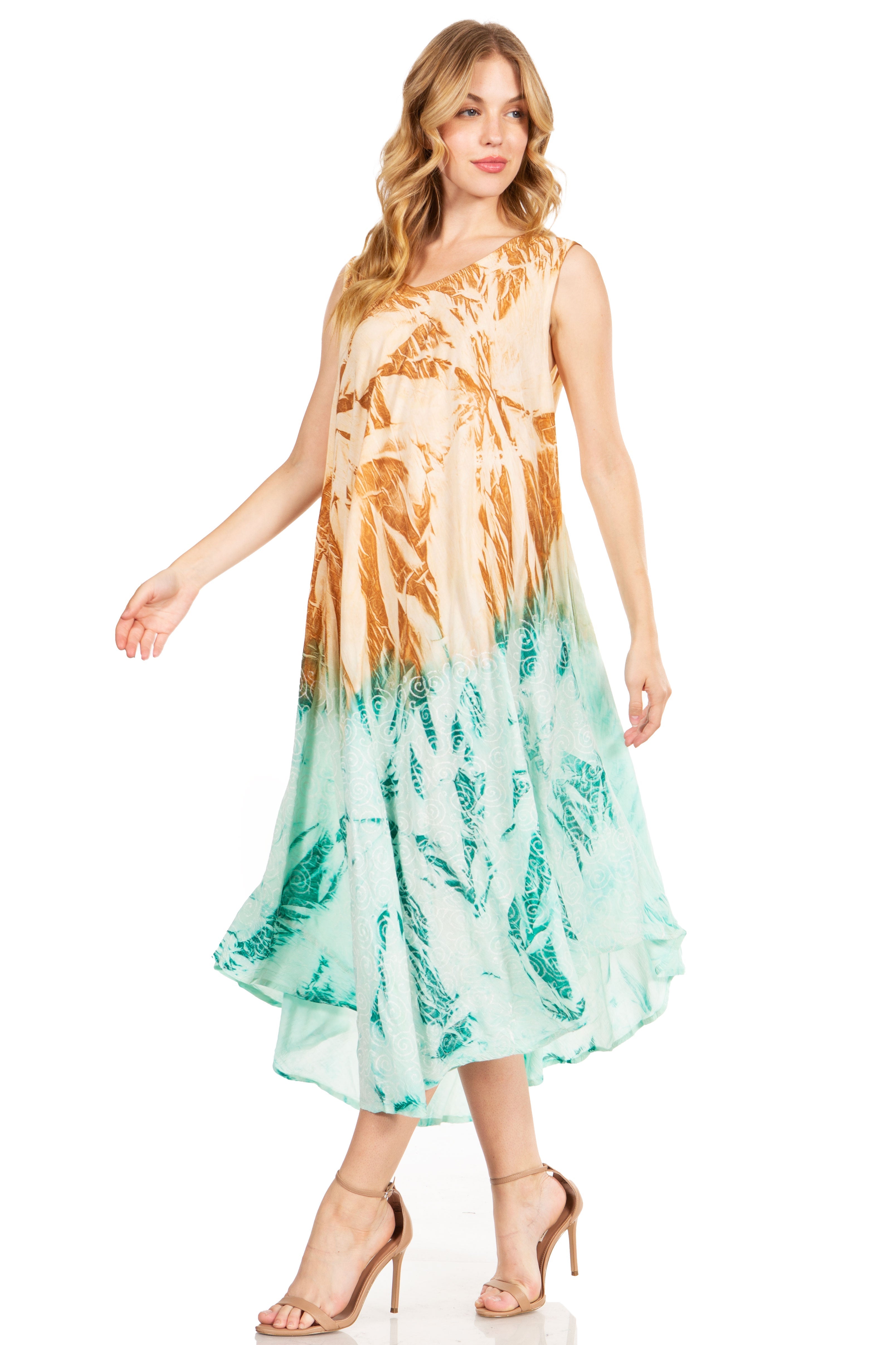 Woman wearing a sleeveless dress with a colorful leaf pattern on a white background