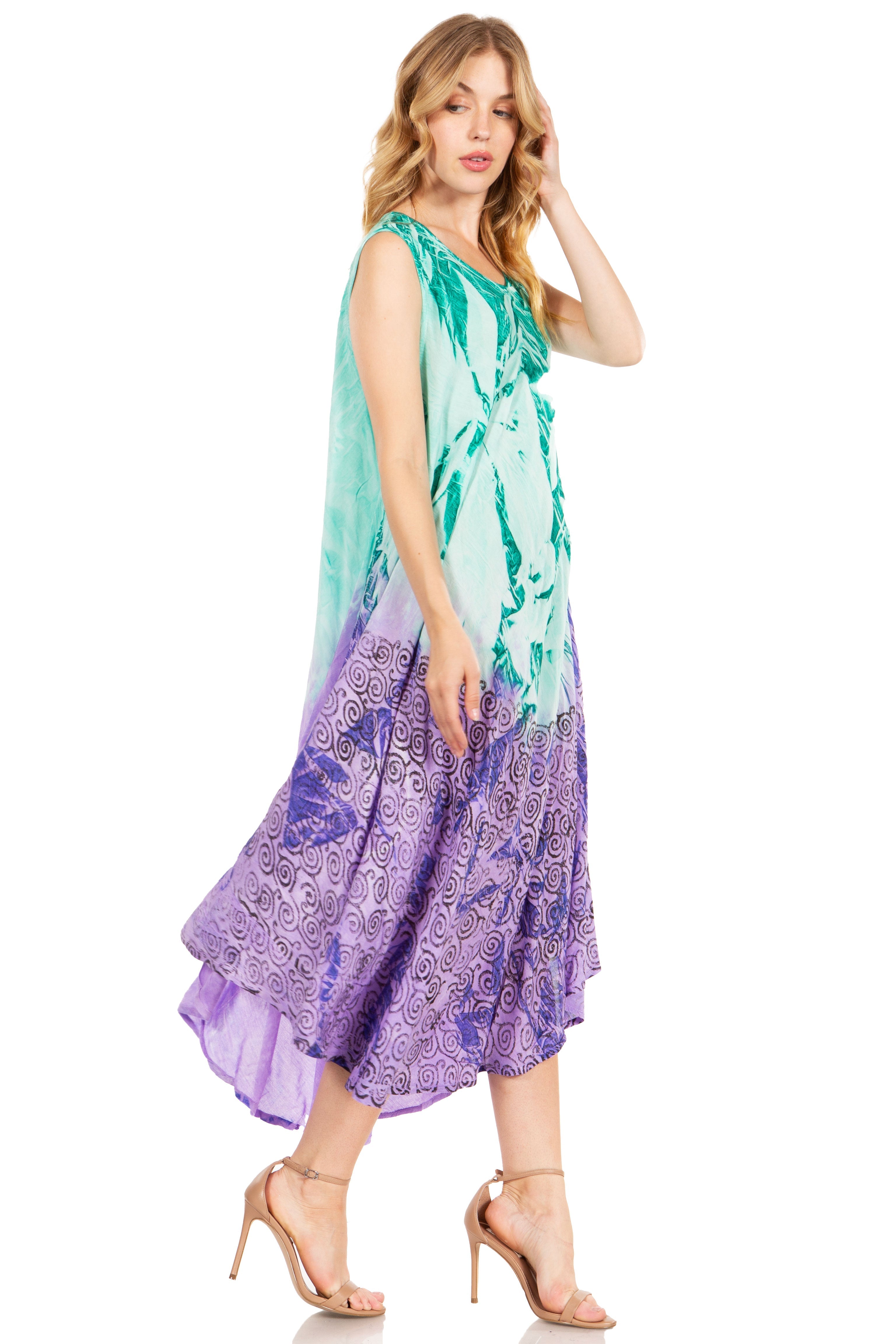 Woman wearing a colorful dress with a gradient from green to purple on a white background