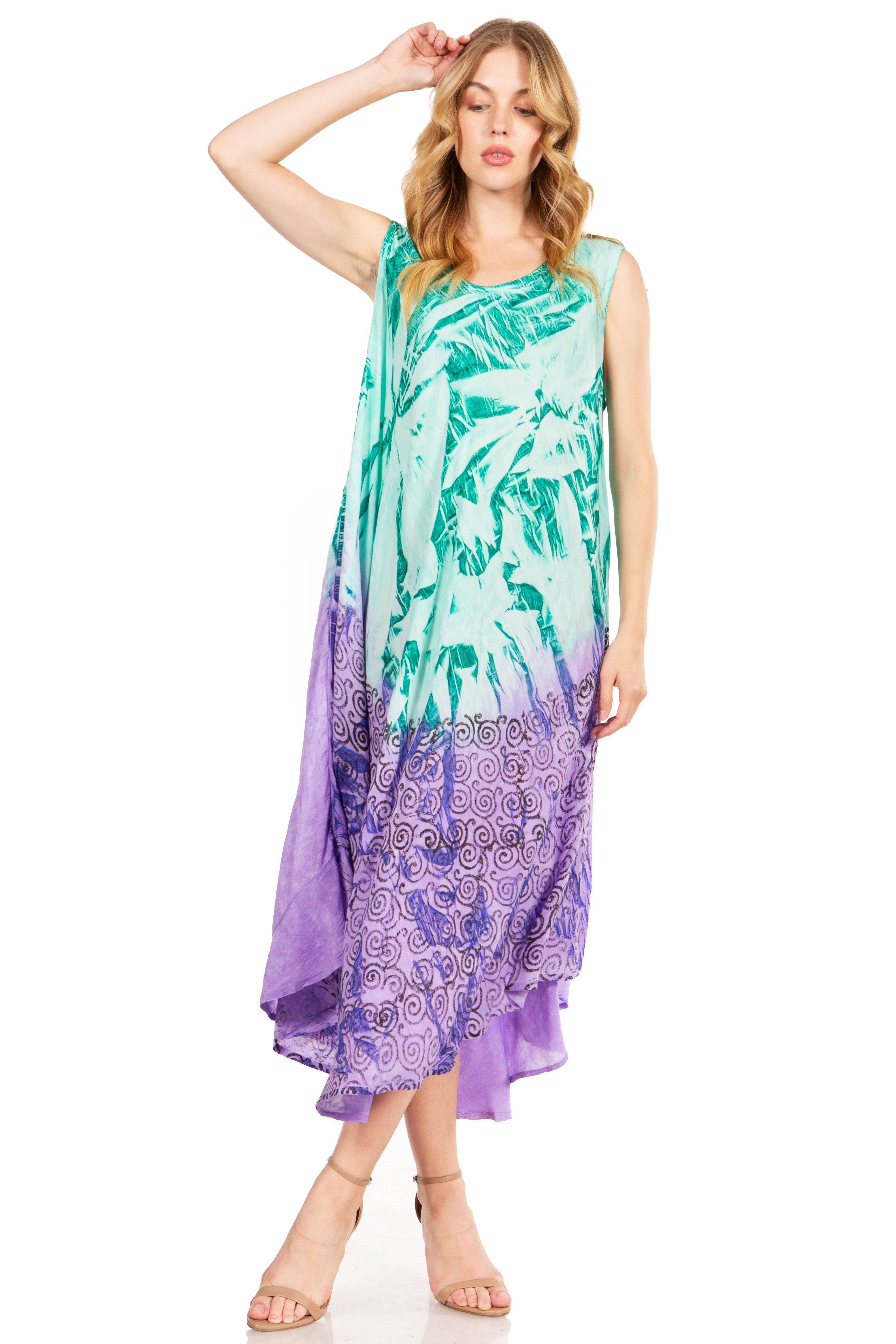 Woman wearing a colorful dress with a palm leaf pattern on a white background