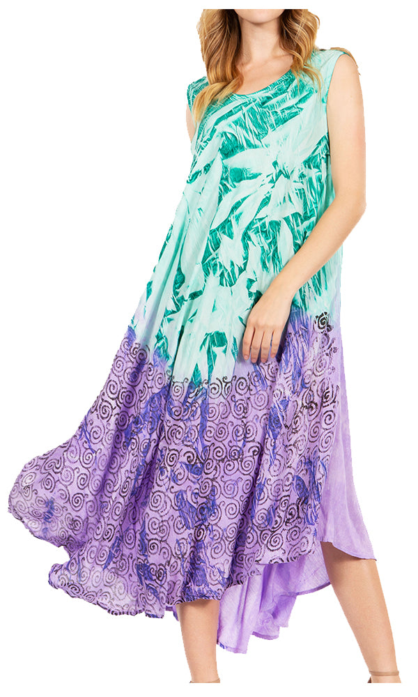Woman wearing a colorful dress with a tropical leaf pattern on a white background