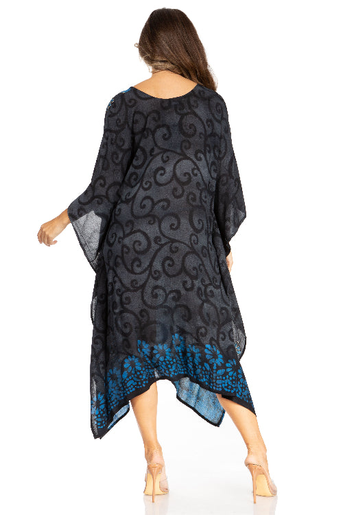Woman wearing a black and blue patterned dress on a white background