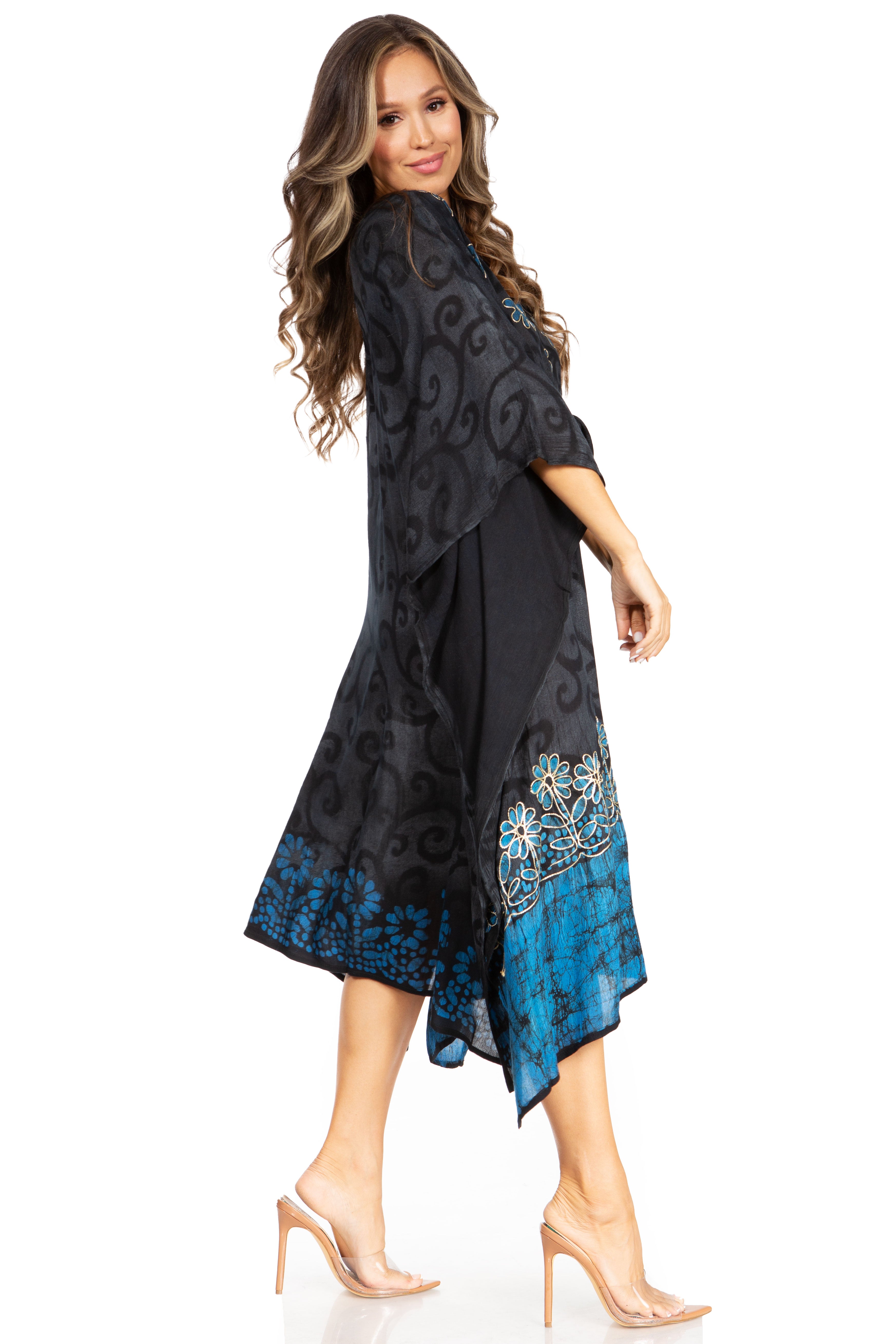 Woman wearing a black and blue patterned dress on a white background