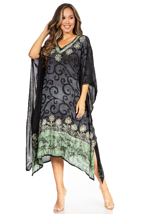 Woman wearing a black and green patterned dress on a white background