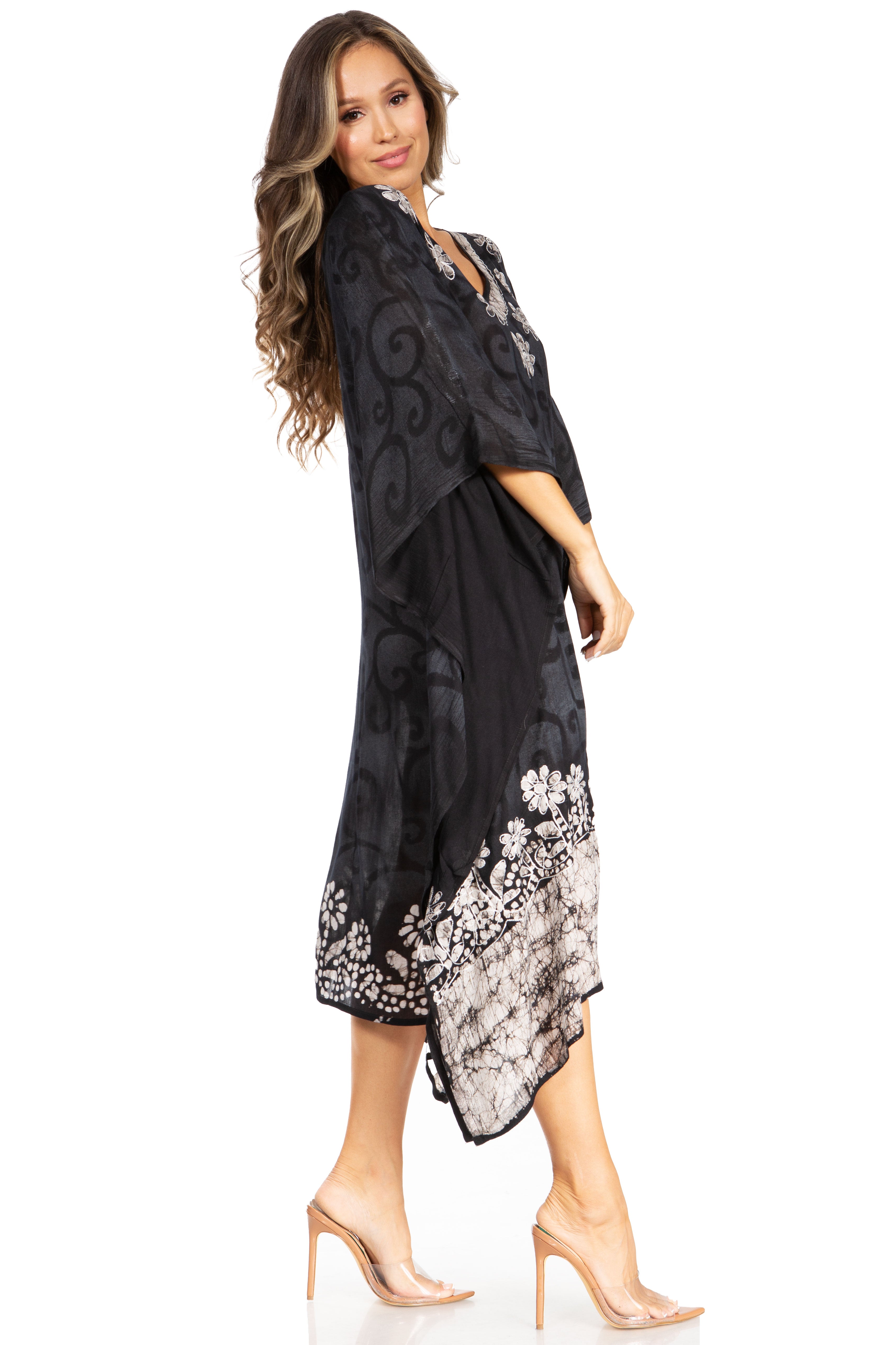 Woman wearing a black floral dress on a white background