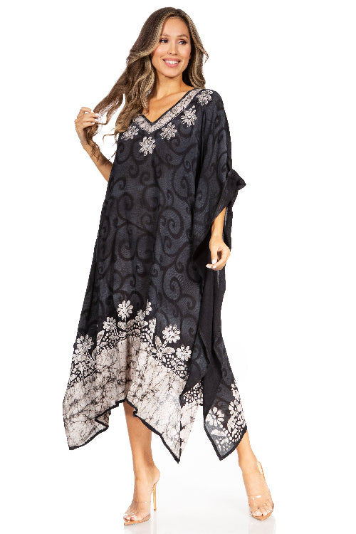 Woman wearing a black floral patterned dress on a white background