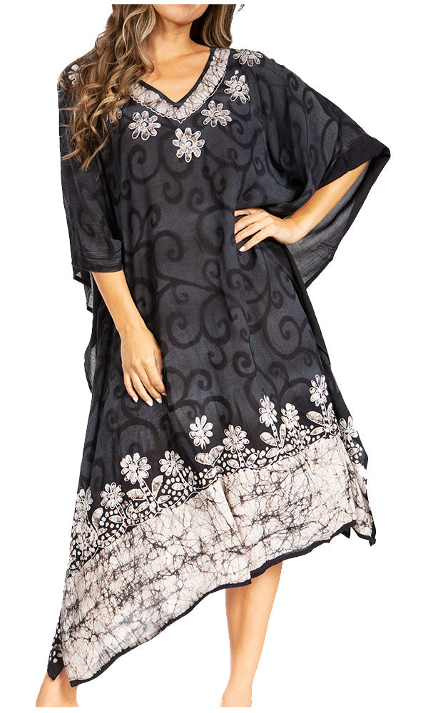 Black dress with white floral embroidery on a plain background