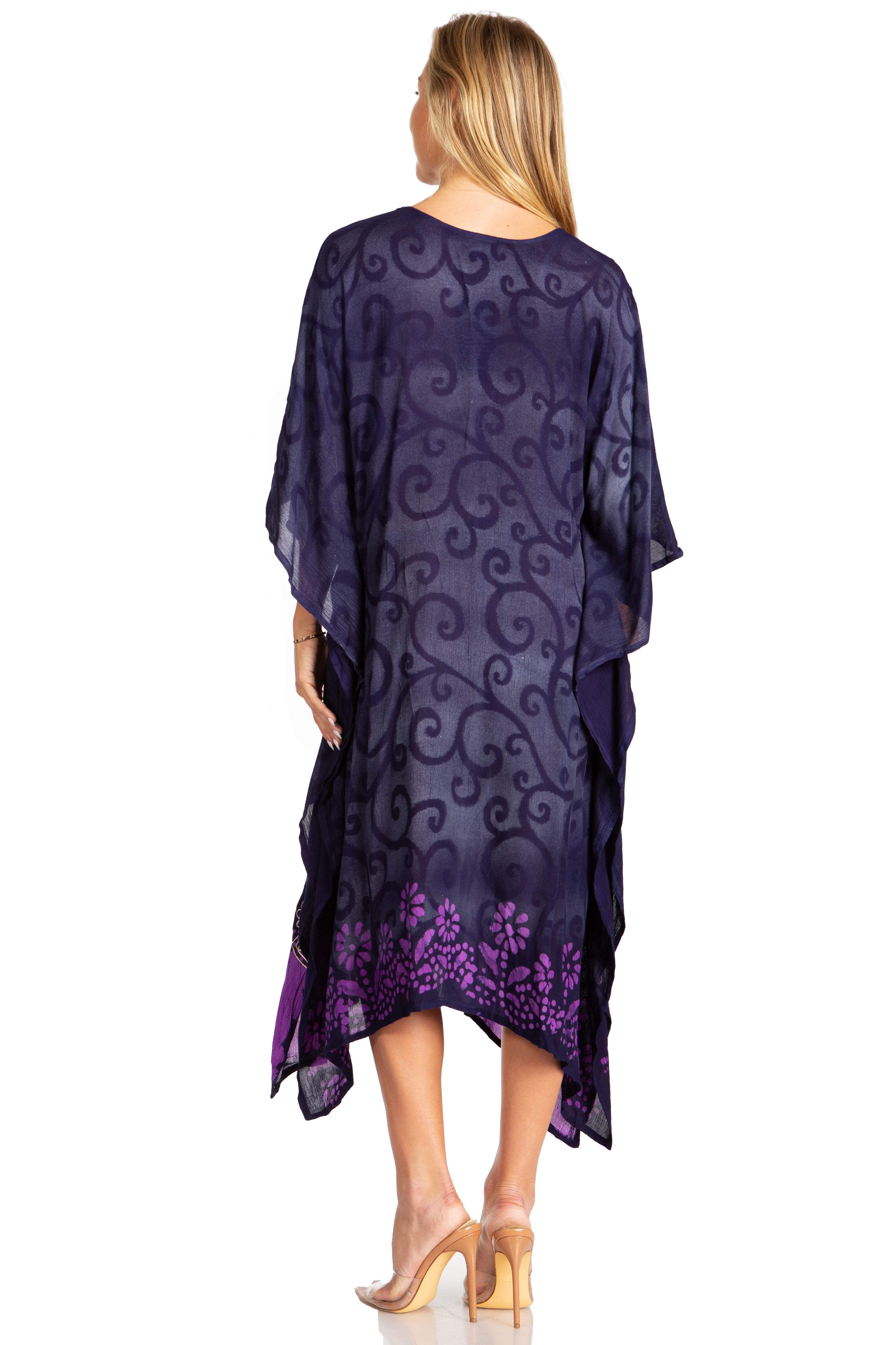 Woman wearing a purple patterned dress on a white background