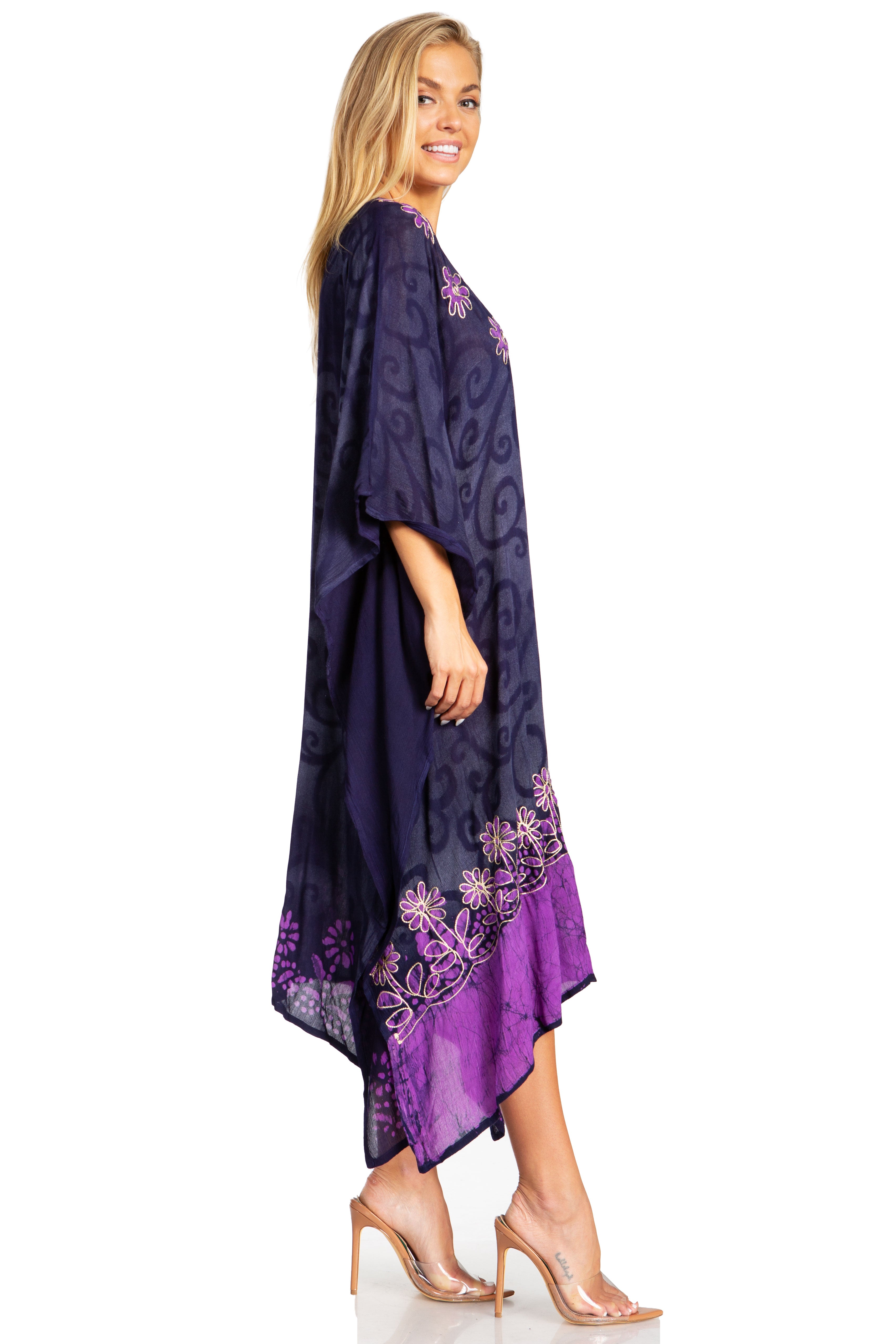 Woman wearing a purple embroidered dress on a white background