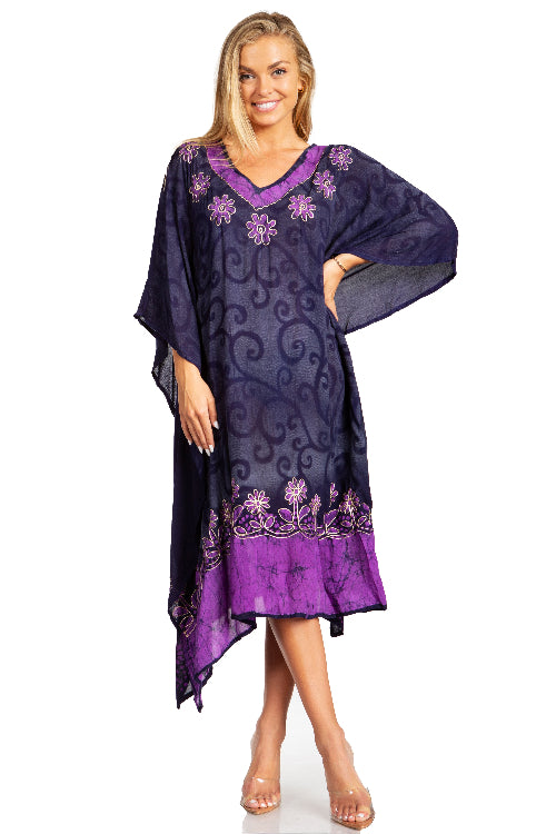 Woman wearing a purple embroidered dress on a white background
