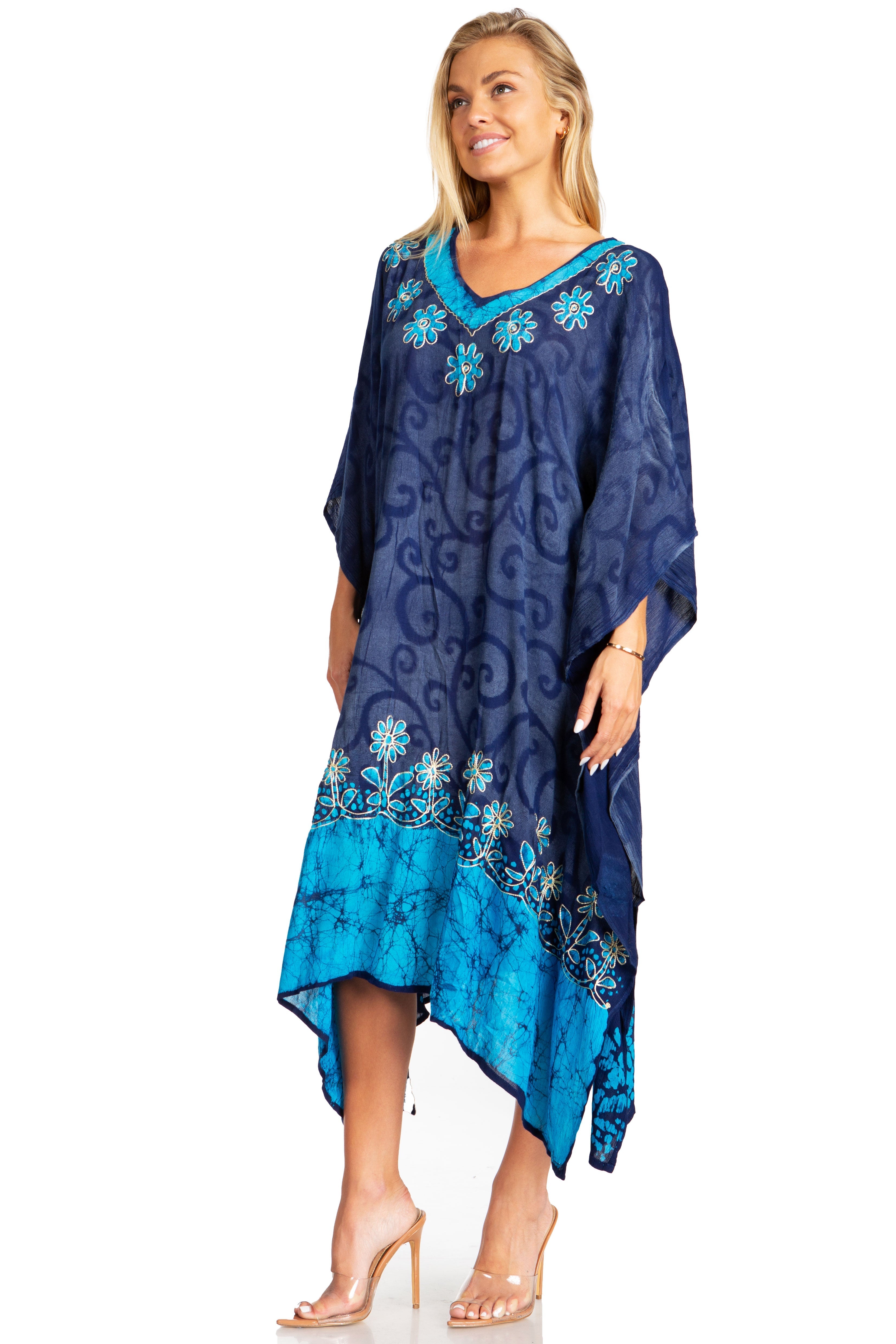 Woman wearing a blue and navy patterned dress on a white background