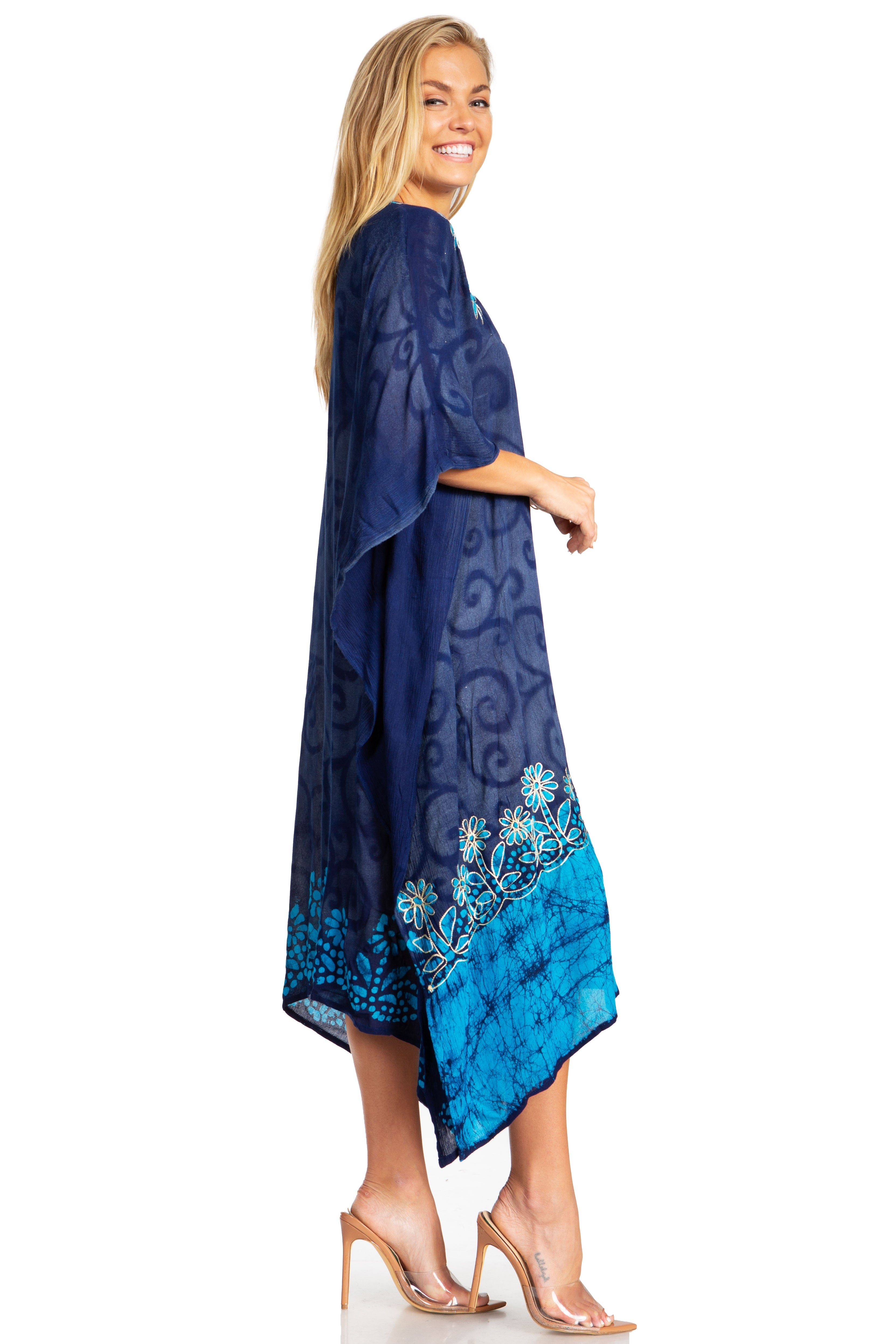Woman wearing a blue patterned dress with a white background