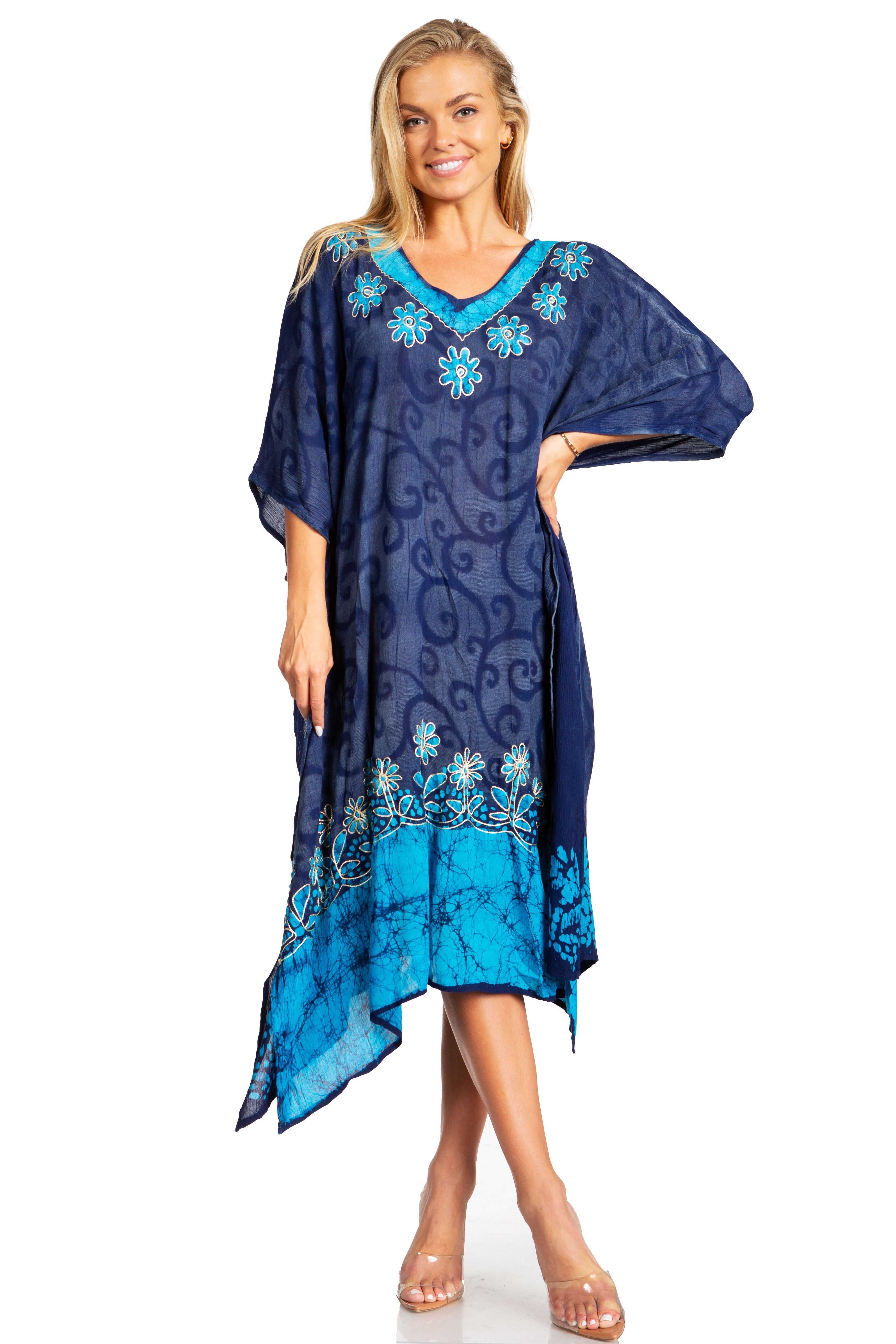 Woman wearing a blue and navy patterned dress on a white background