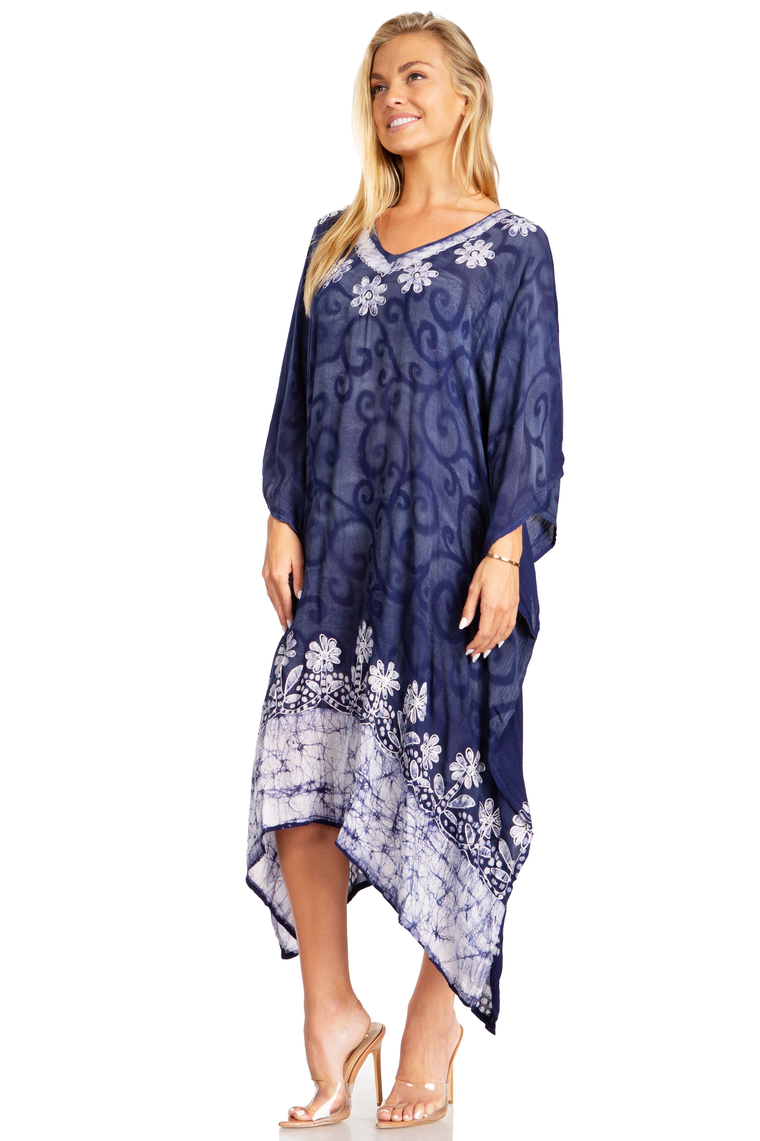 Woman wearing a blue floral patterned dress on a white background