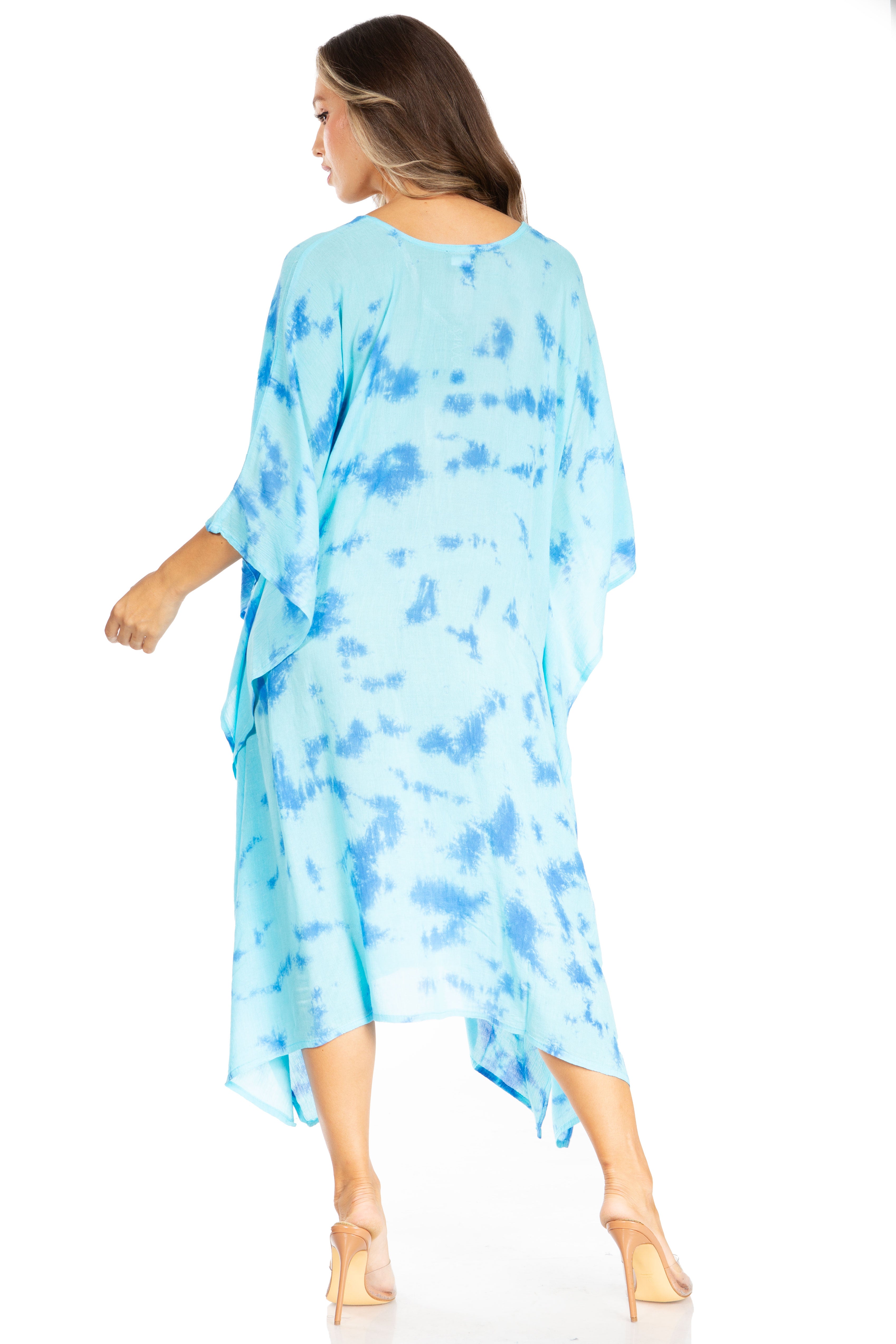 Woman wearing a blue tie-dye dress on a white background