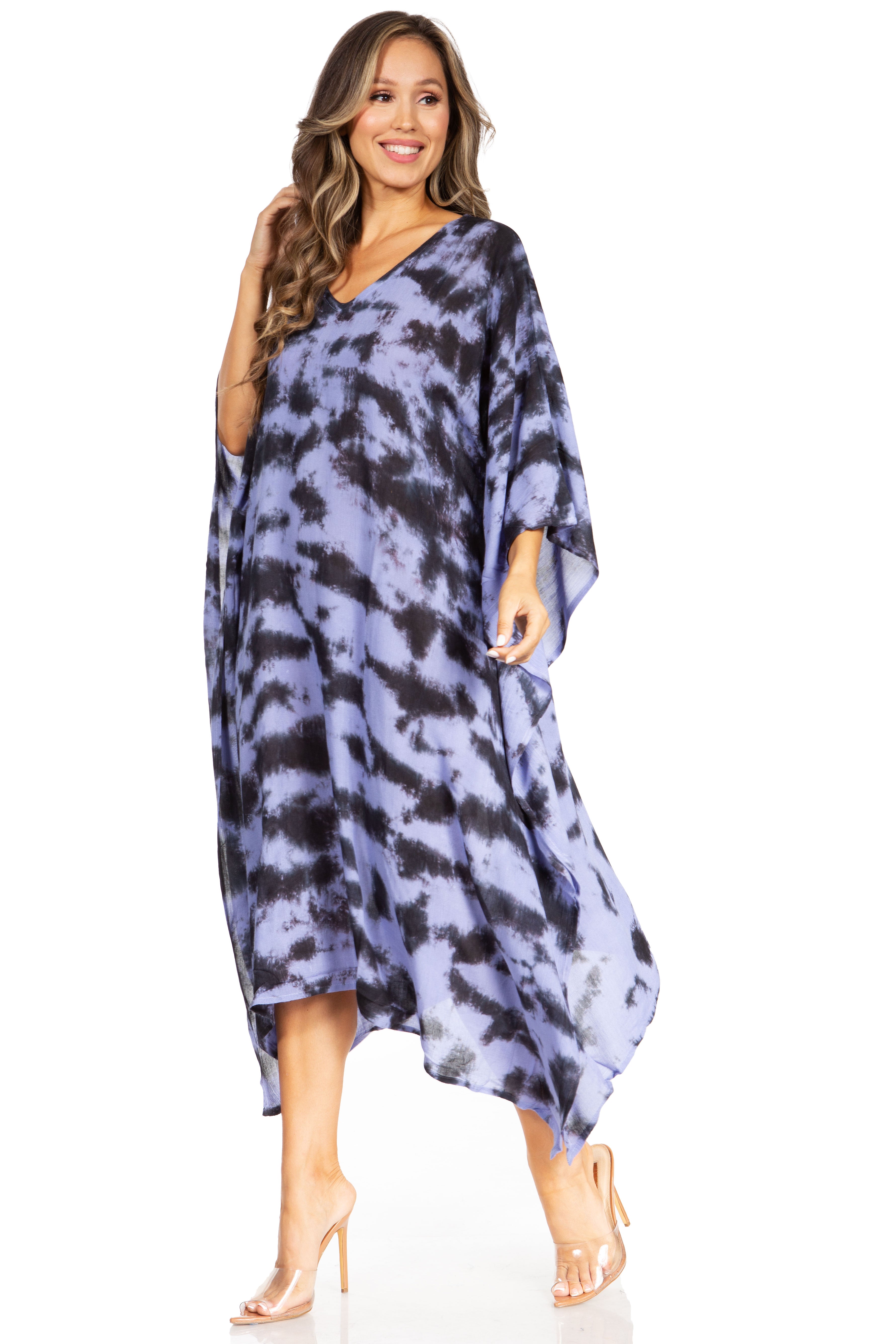 Woman wearing a blue tie-dye dress on a white background