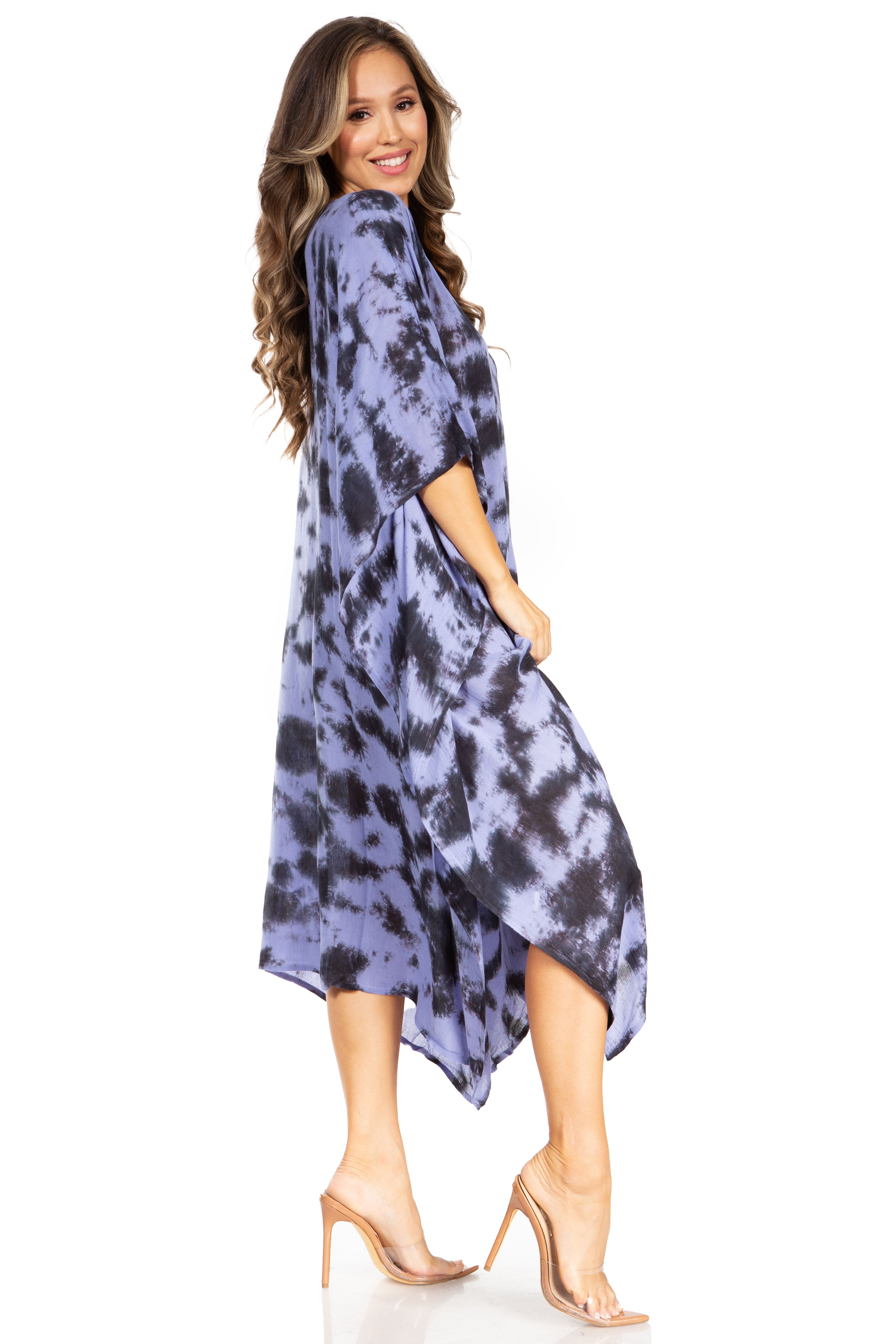 Woman wearing a blue tie-dye dress on a white background