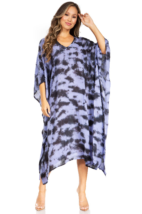 Woman wearing a blue tie-dye dress on a white background