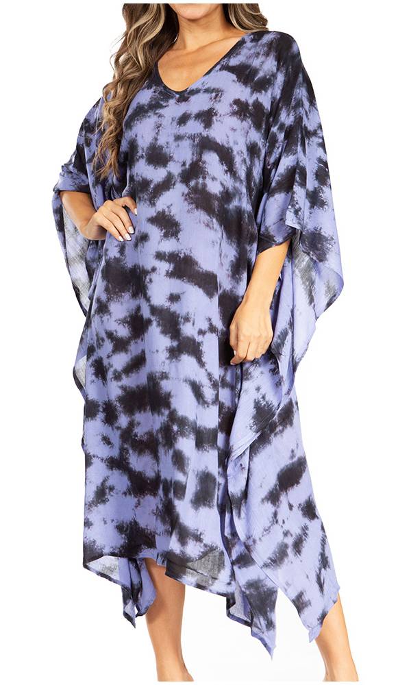 Woman wearing a blue tie-dye dress on a white background