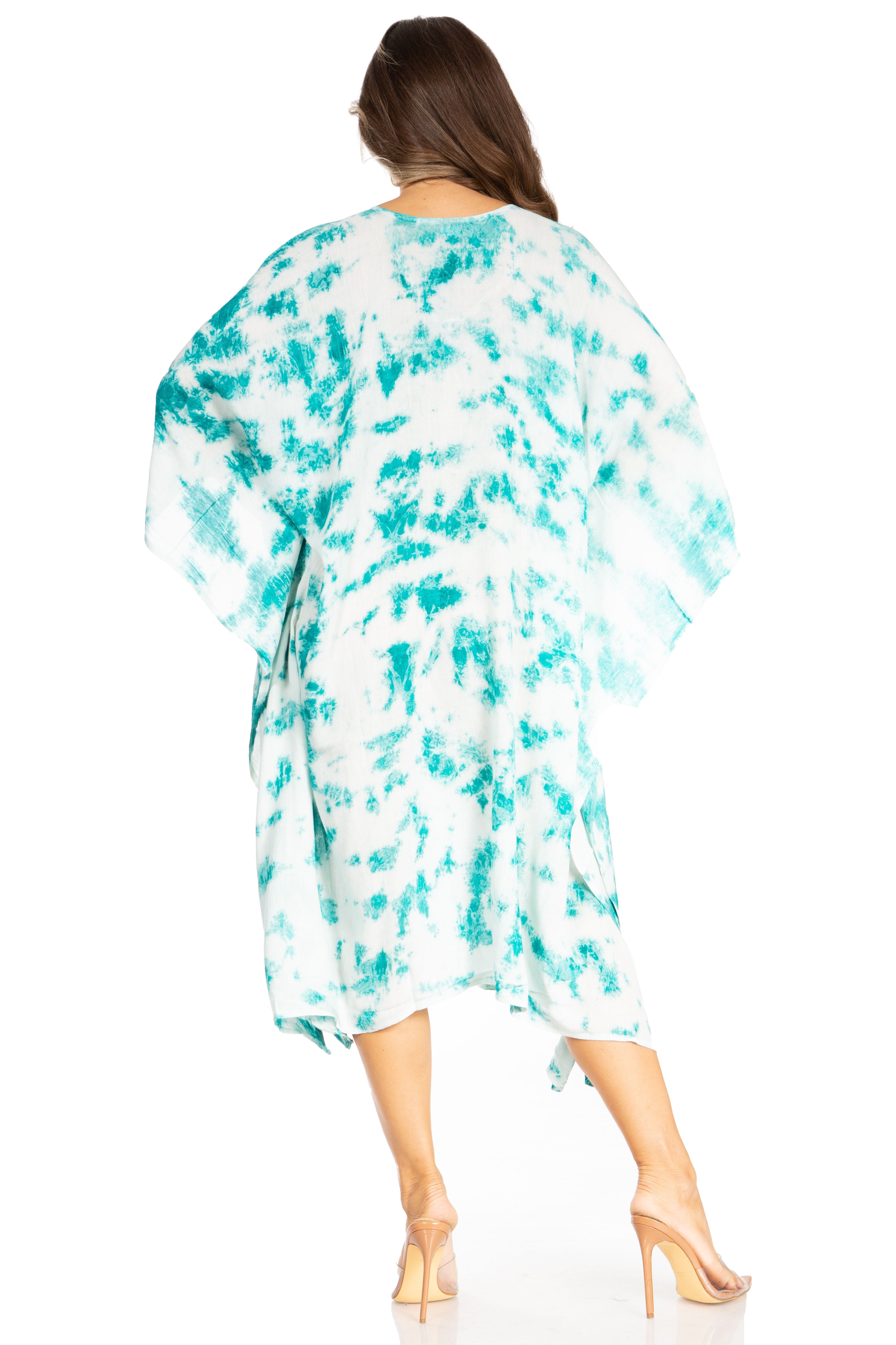 Woman wearing a turquoise and white tie-dye kimono on a white background