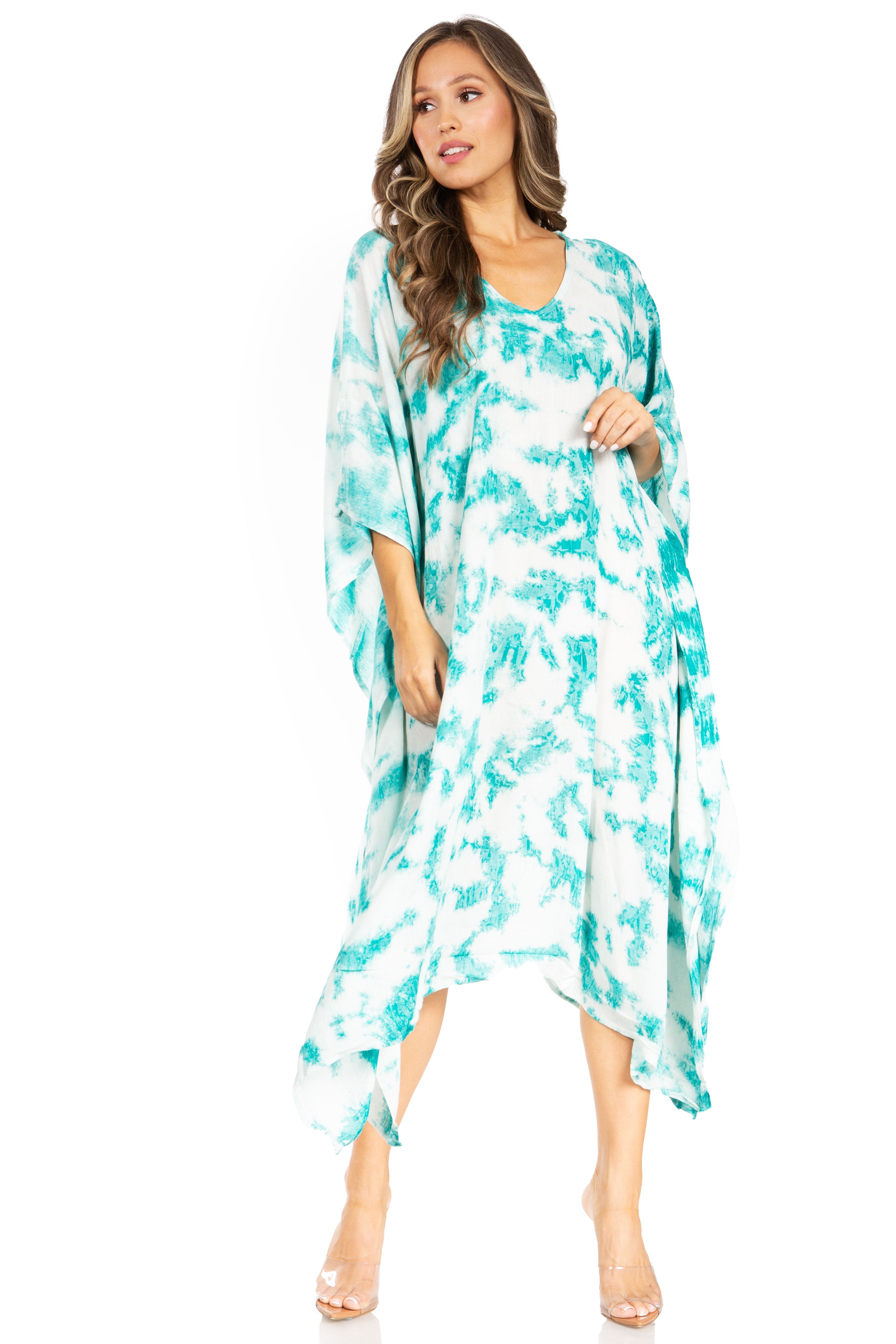 Woman wearing a turquoise floral dress on a white background