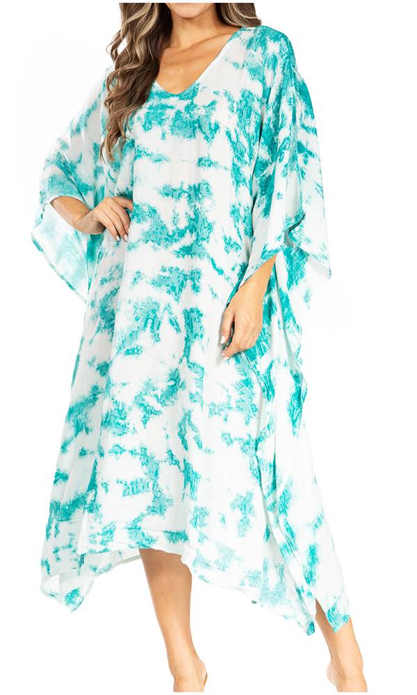 Woman wearing a turquoise and white patterned dress on a white background