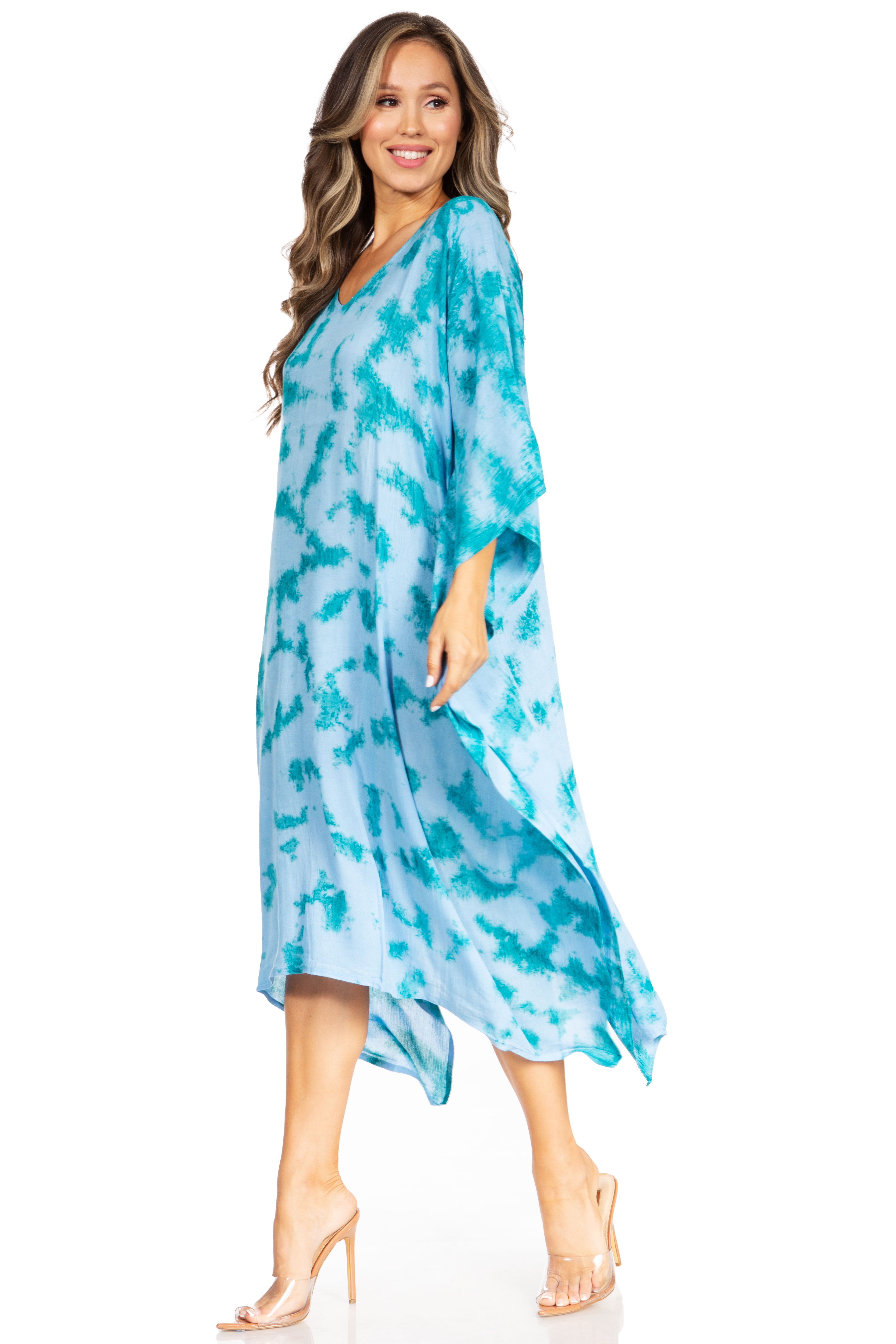 Woman wearing a blue patterned dress on a white background