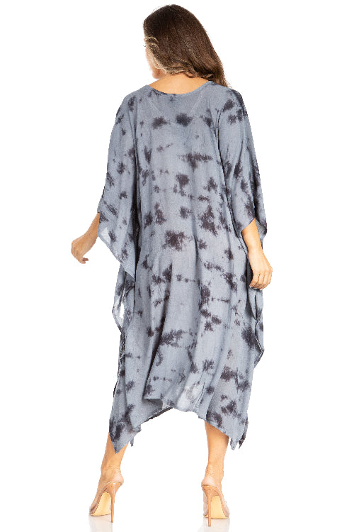 Woman wearing a gray tie-dye kimono-style dress on a white background