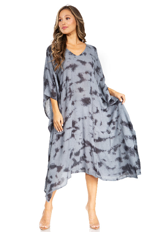 Woman wearing a gray tie-dye dress on a white background