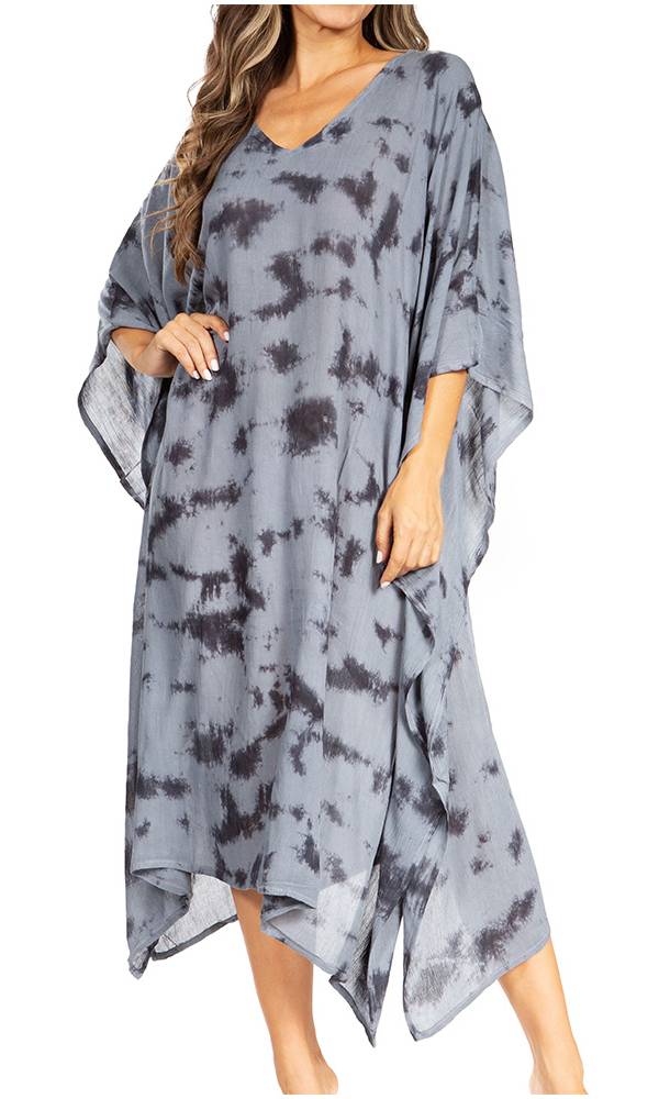 Woman wearing a gray tie-dye dress on a white background