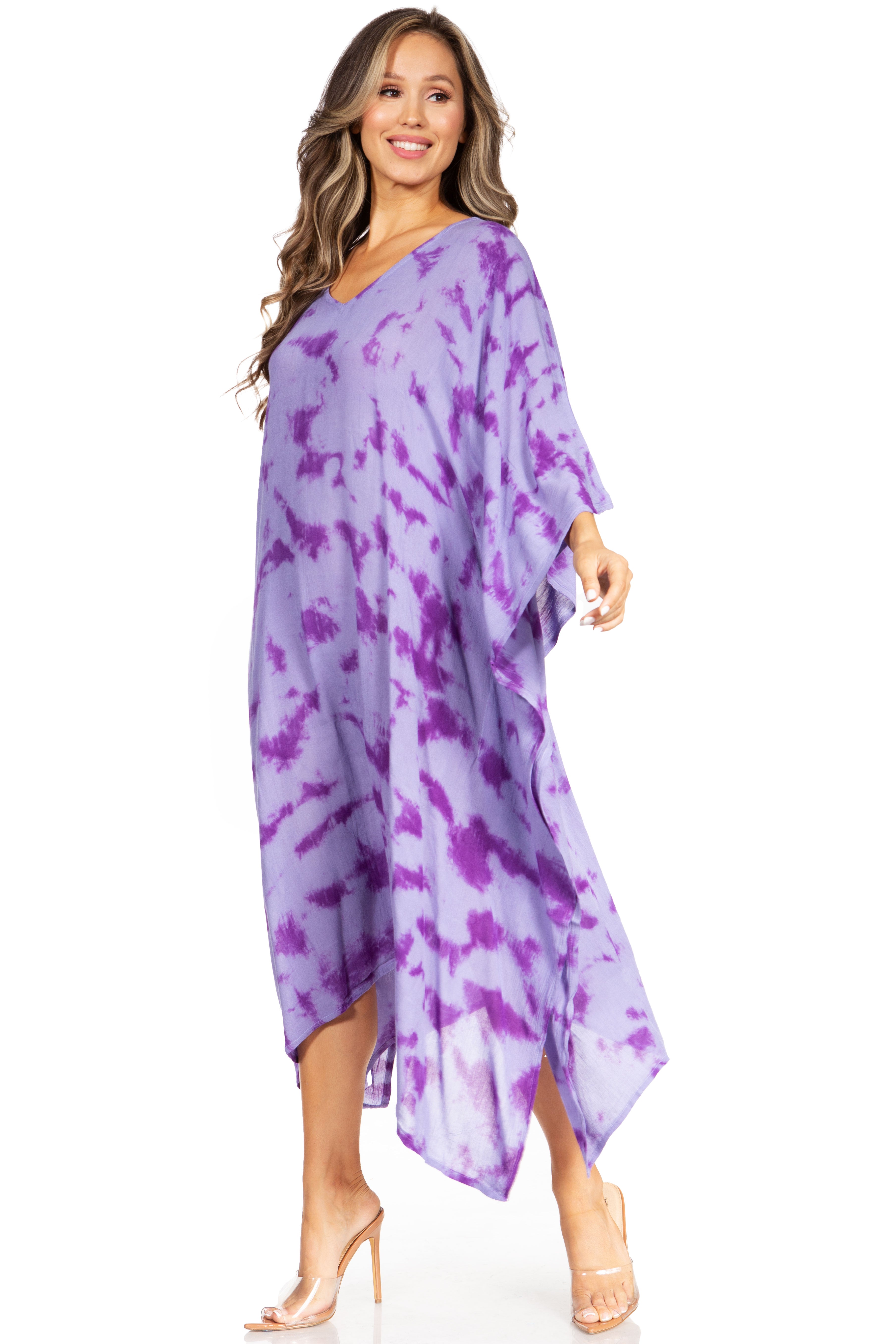 Woman wearing a purple tie-dye dress on a white background