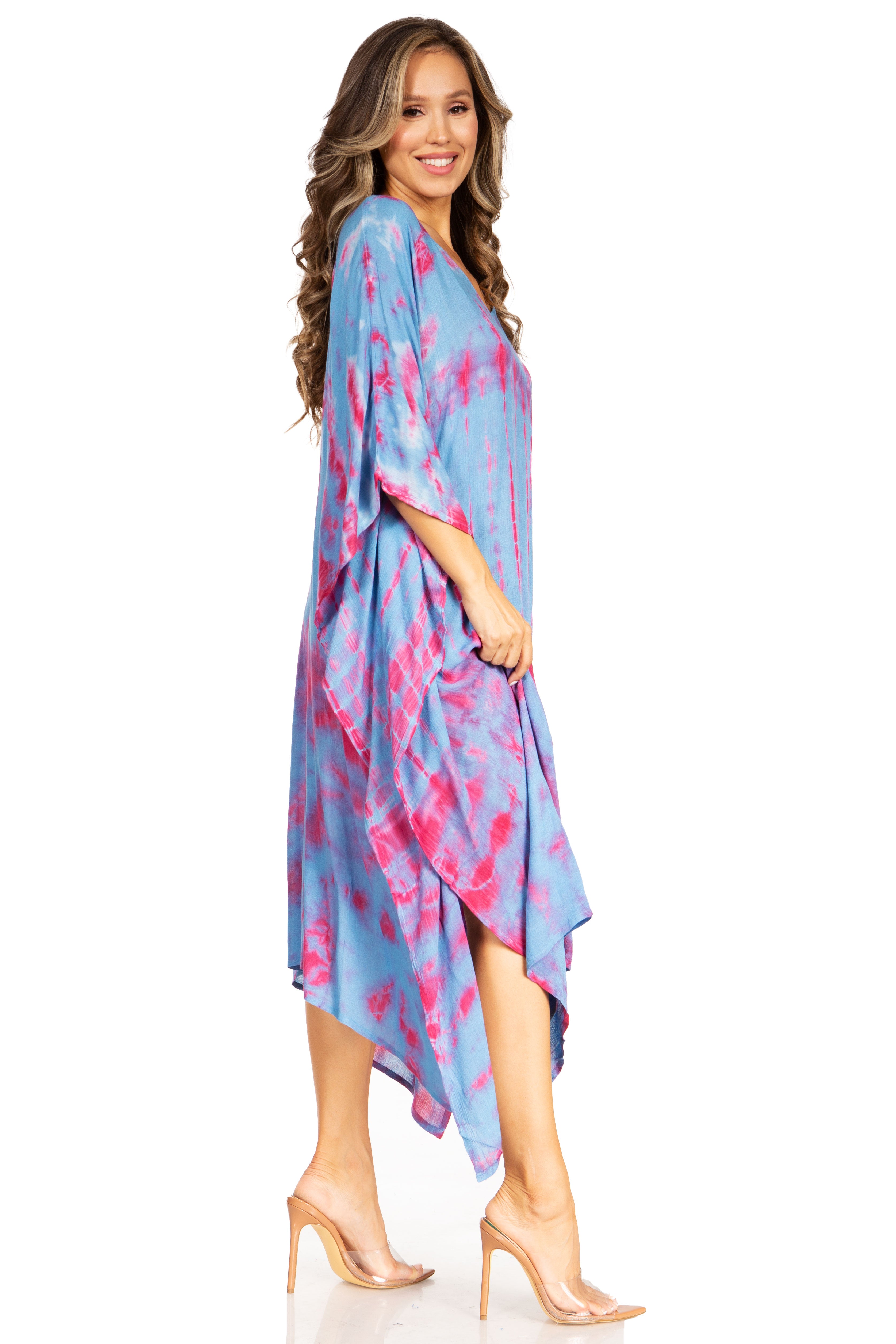 Woman wearing a blue and pink tie-dye dress on a white background