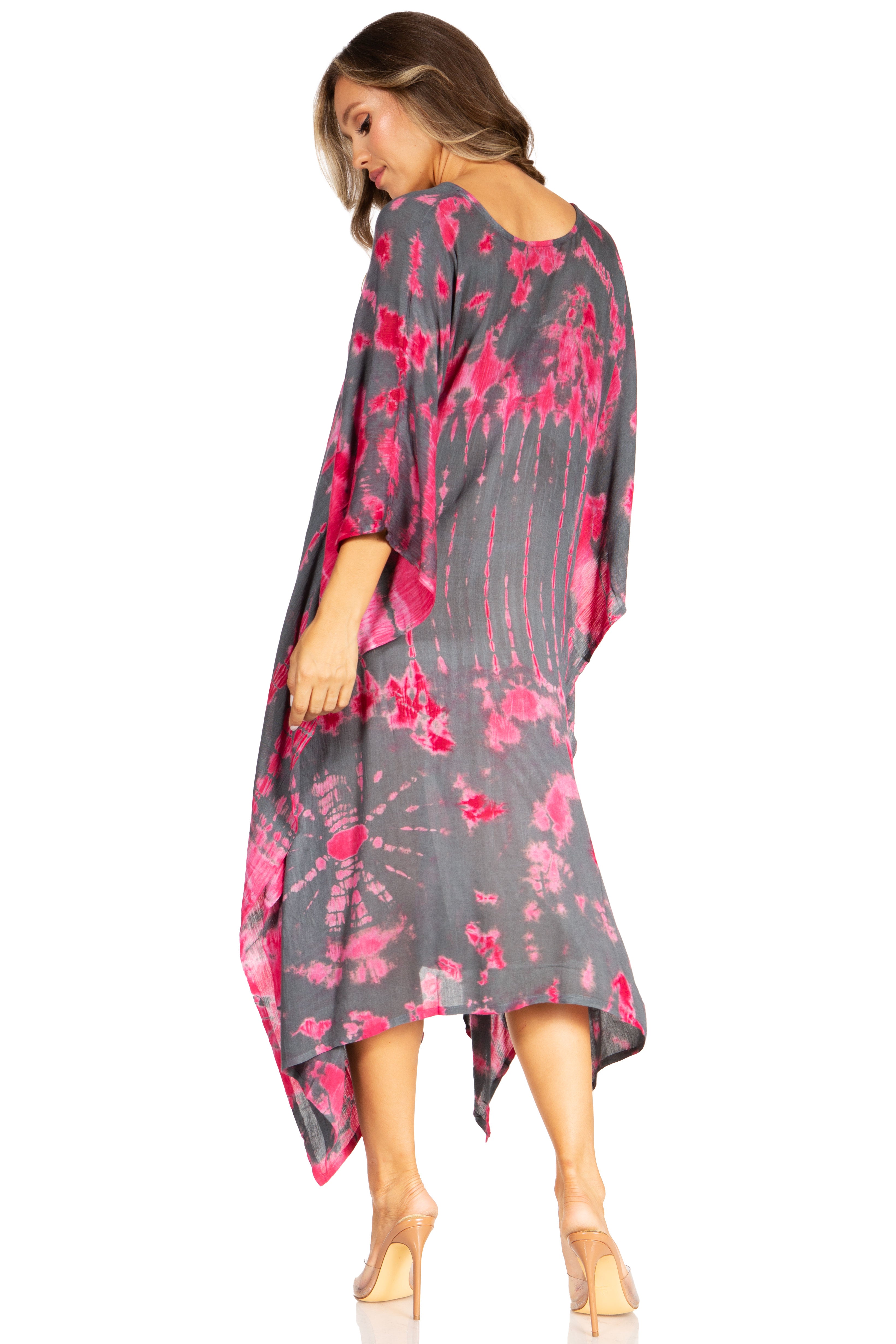Woman wearing a gray and pink floral dress on a white background
