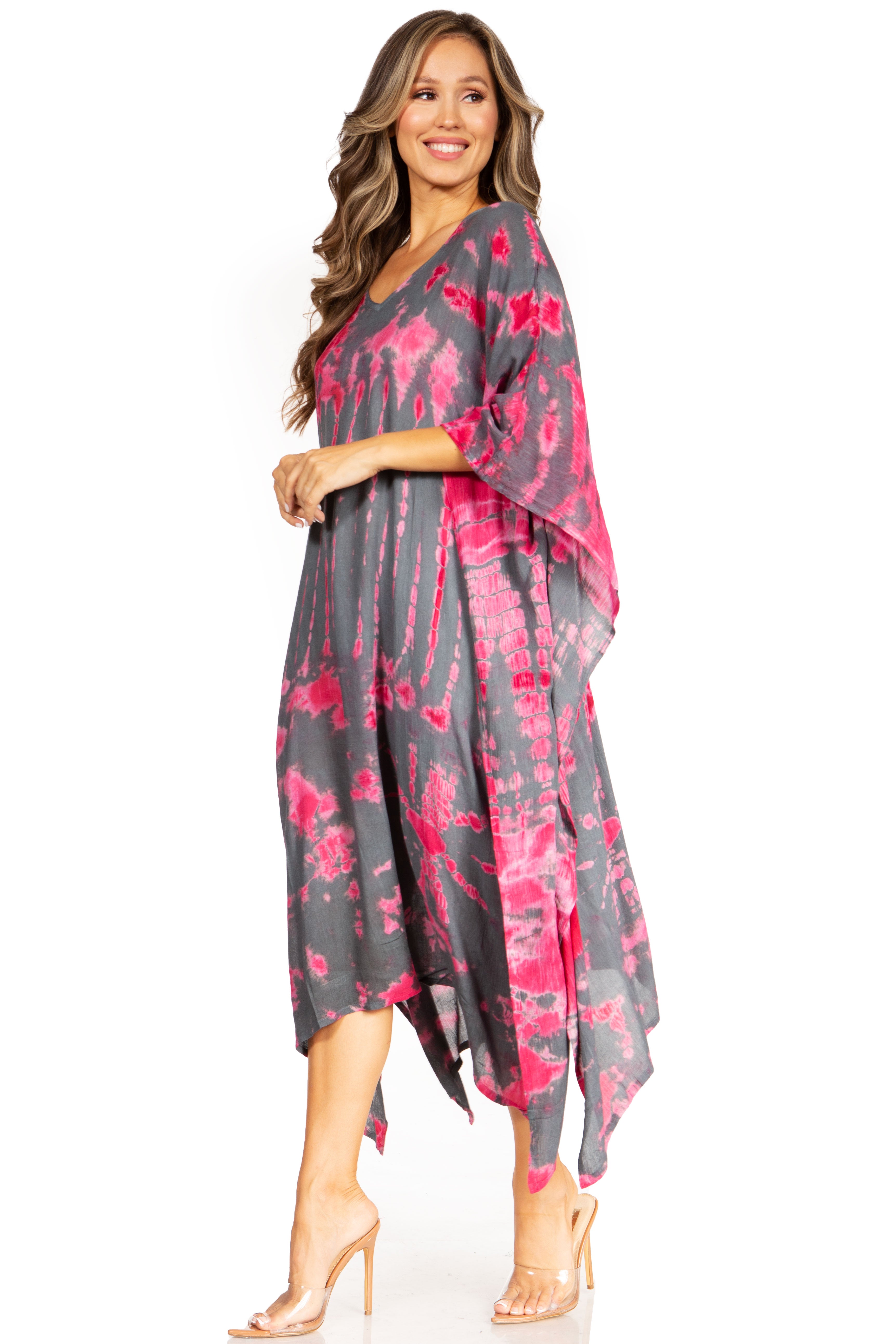 Woman wearing a gray and pink floral dress on a white background