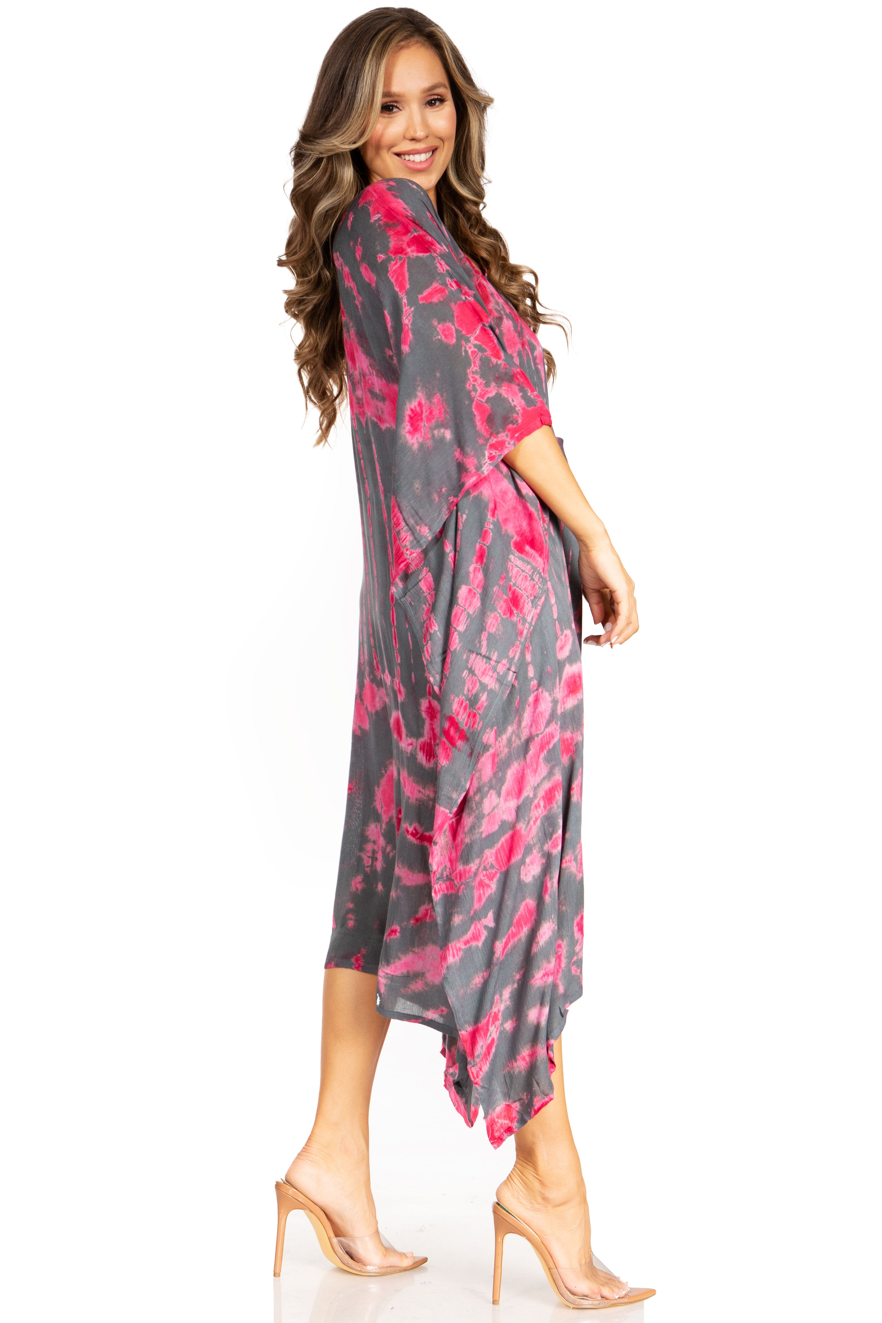 Woman wearing a gray and pink floral dress on a white background
