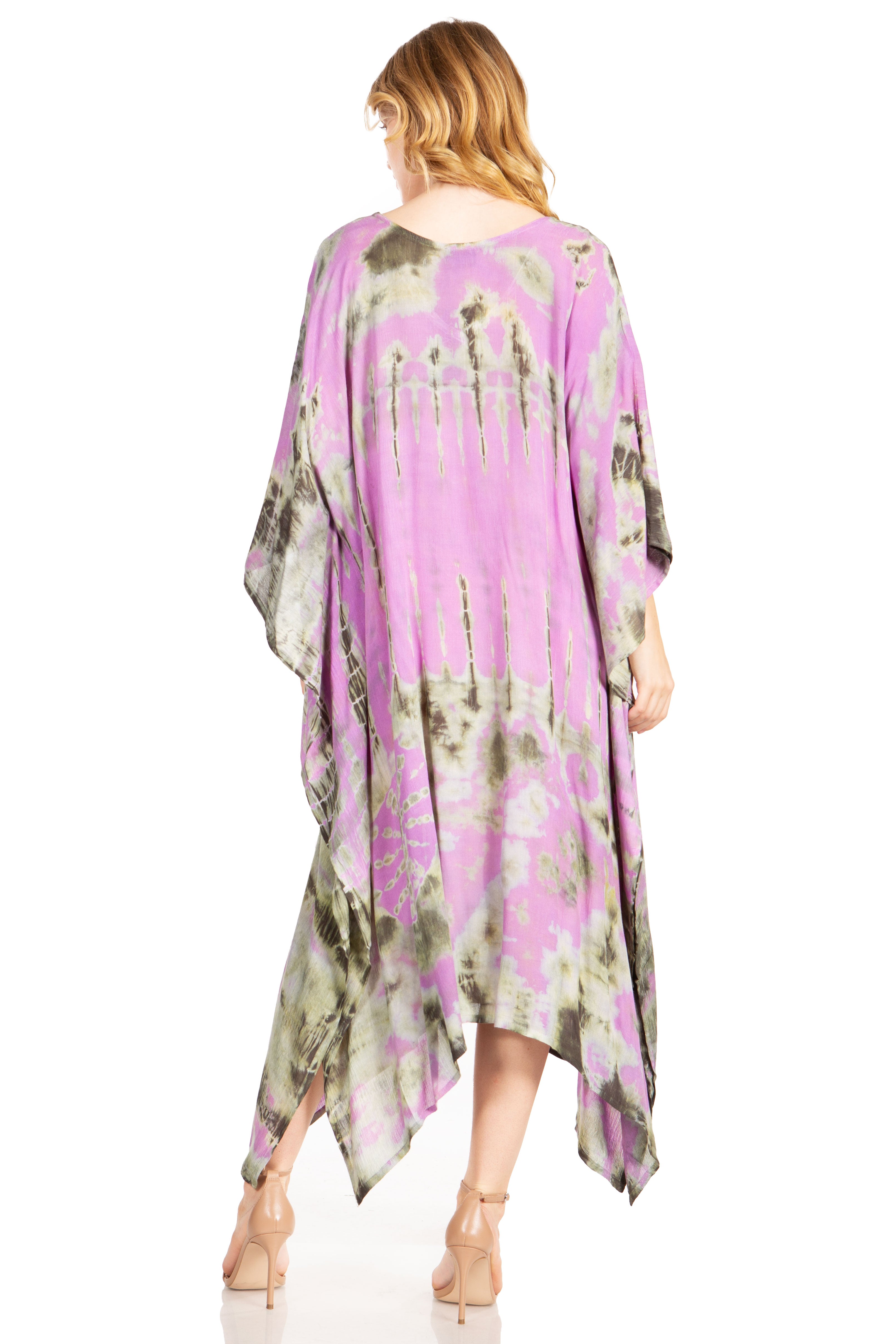 Woman wearing a purple and green floral kimono-style dress on a white background