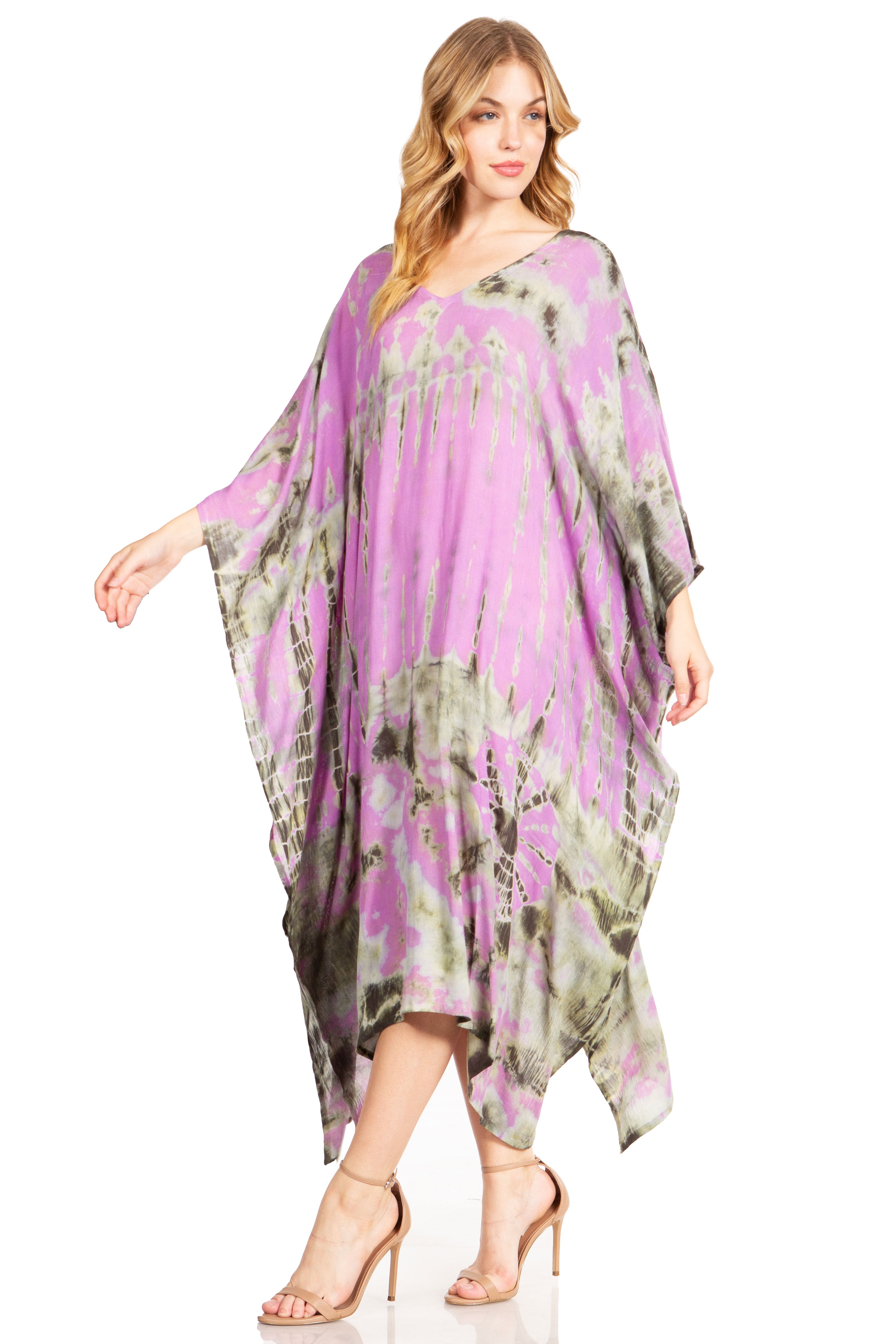 Woman wearing a purple and green floral dress on a white background