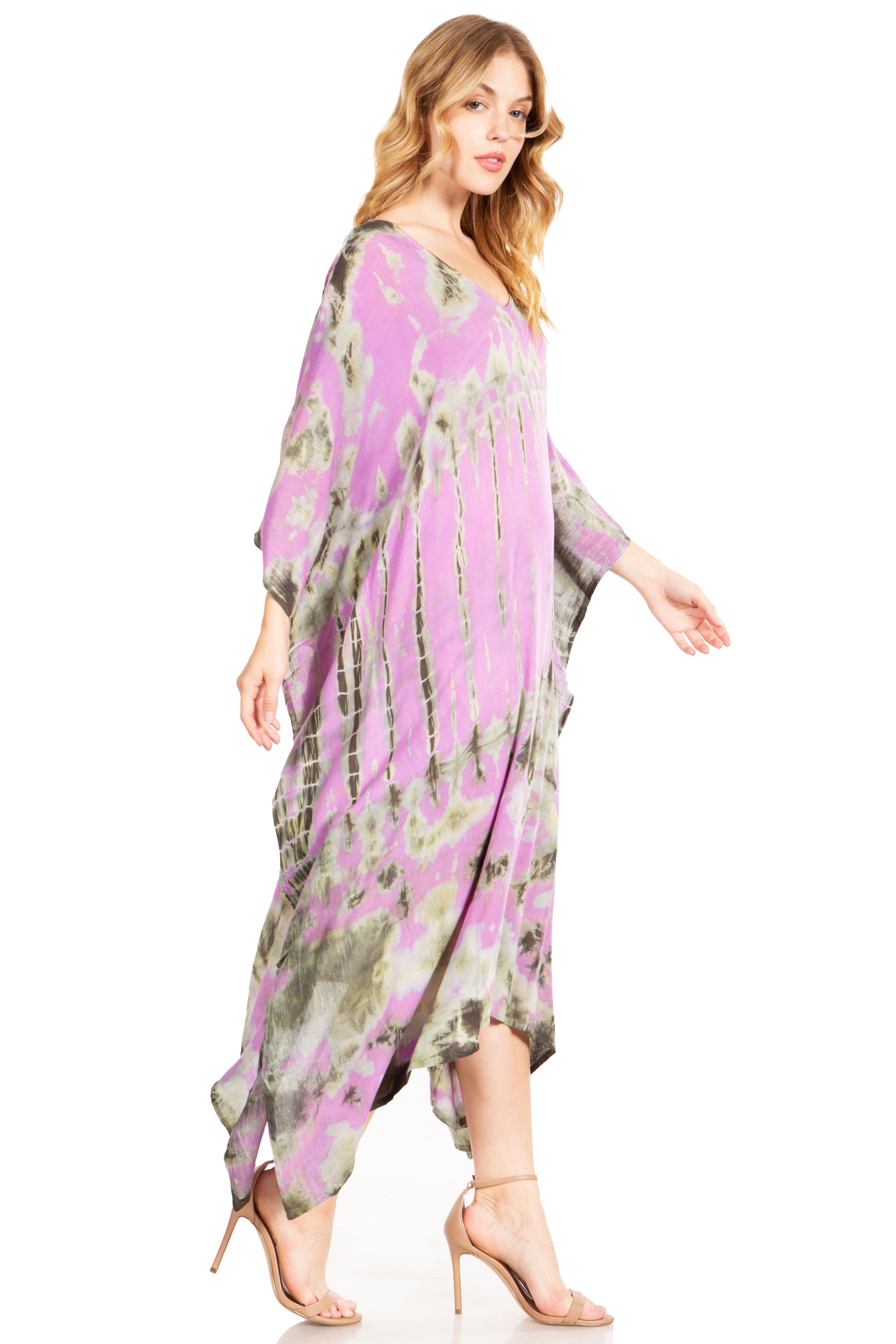 Woman wearing a purple floral dress on a white background