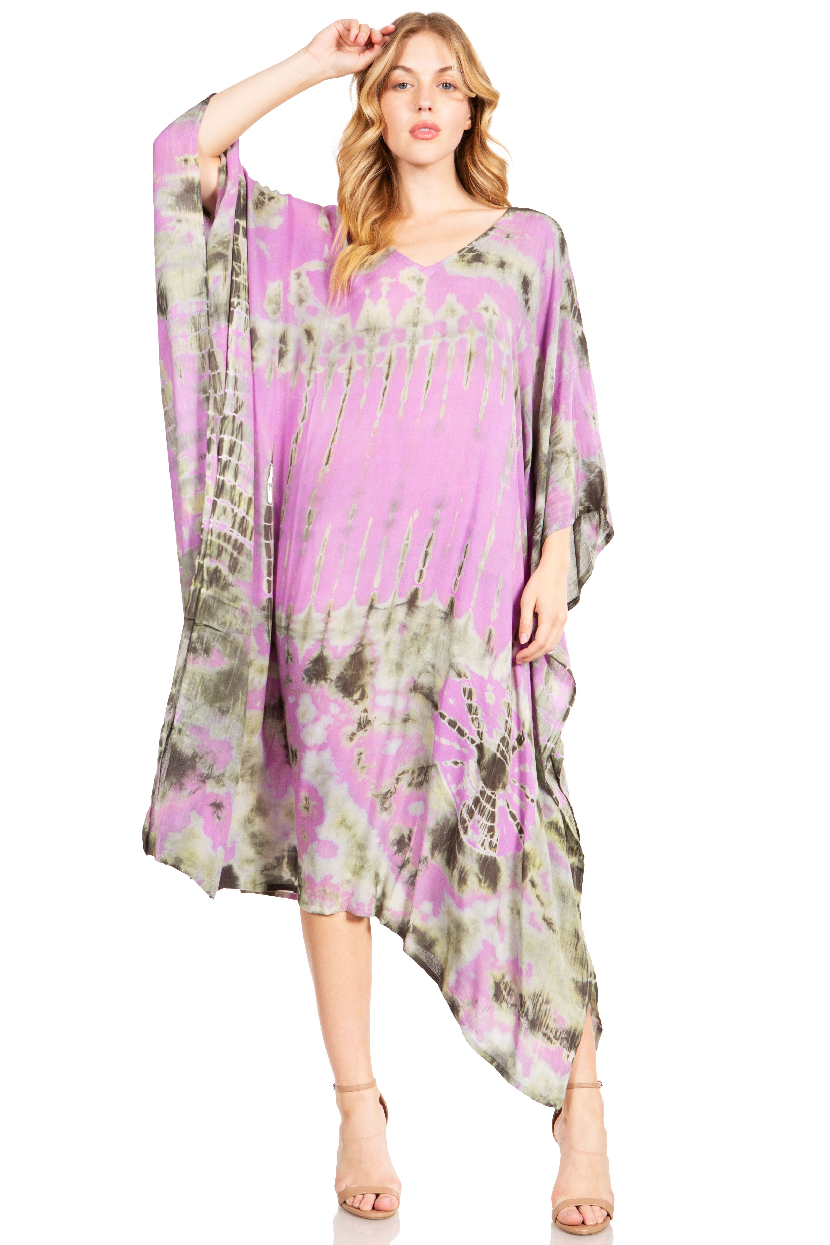 Woman wearing a purple and green floral dress on a white background