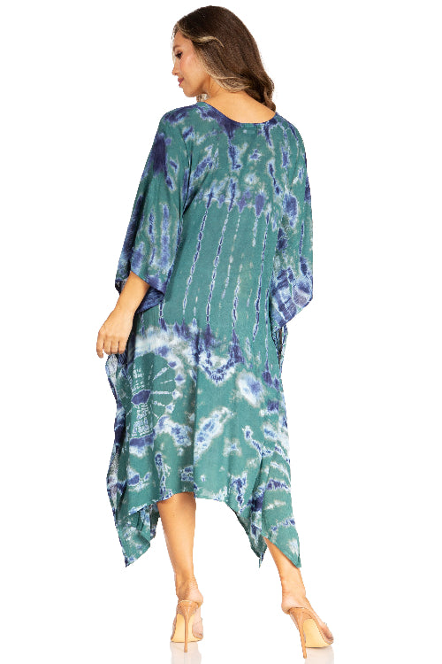 Woman wearing a green and blue patterned dress on a white background