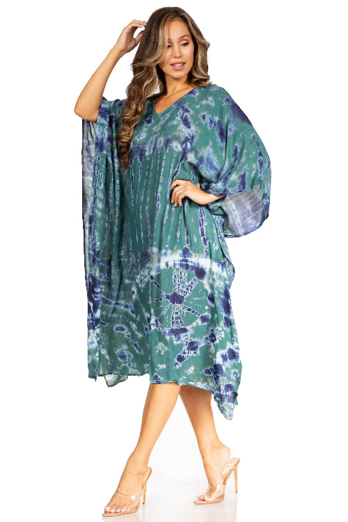 Woman wearing a green and blue tie-dye dress on a white background