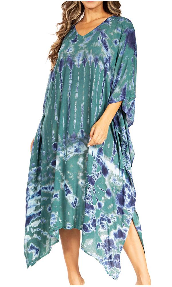 Woman wearing a green and blue patterned dress on a white background