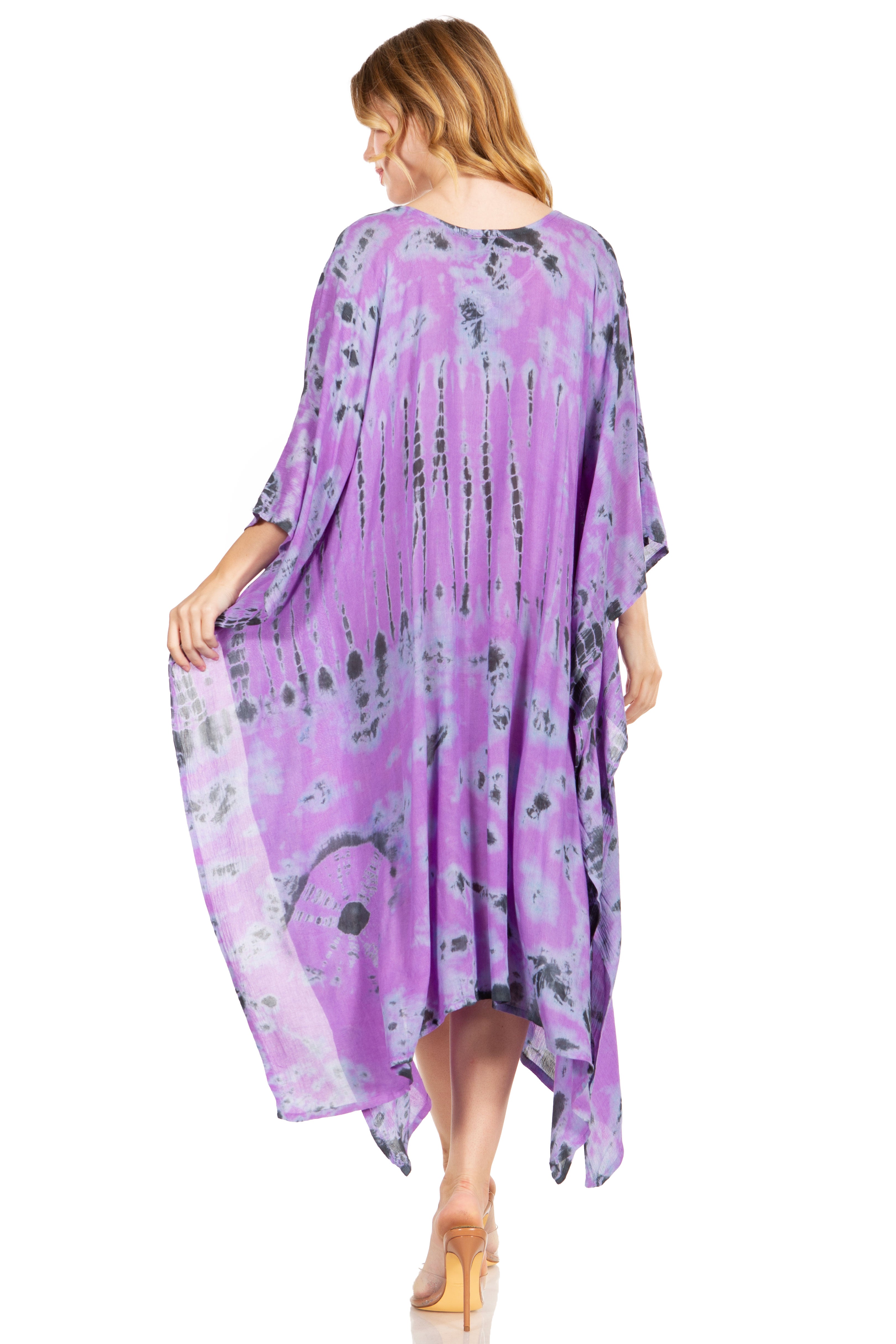 Woman wearing a purple floral dress on a white background