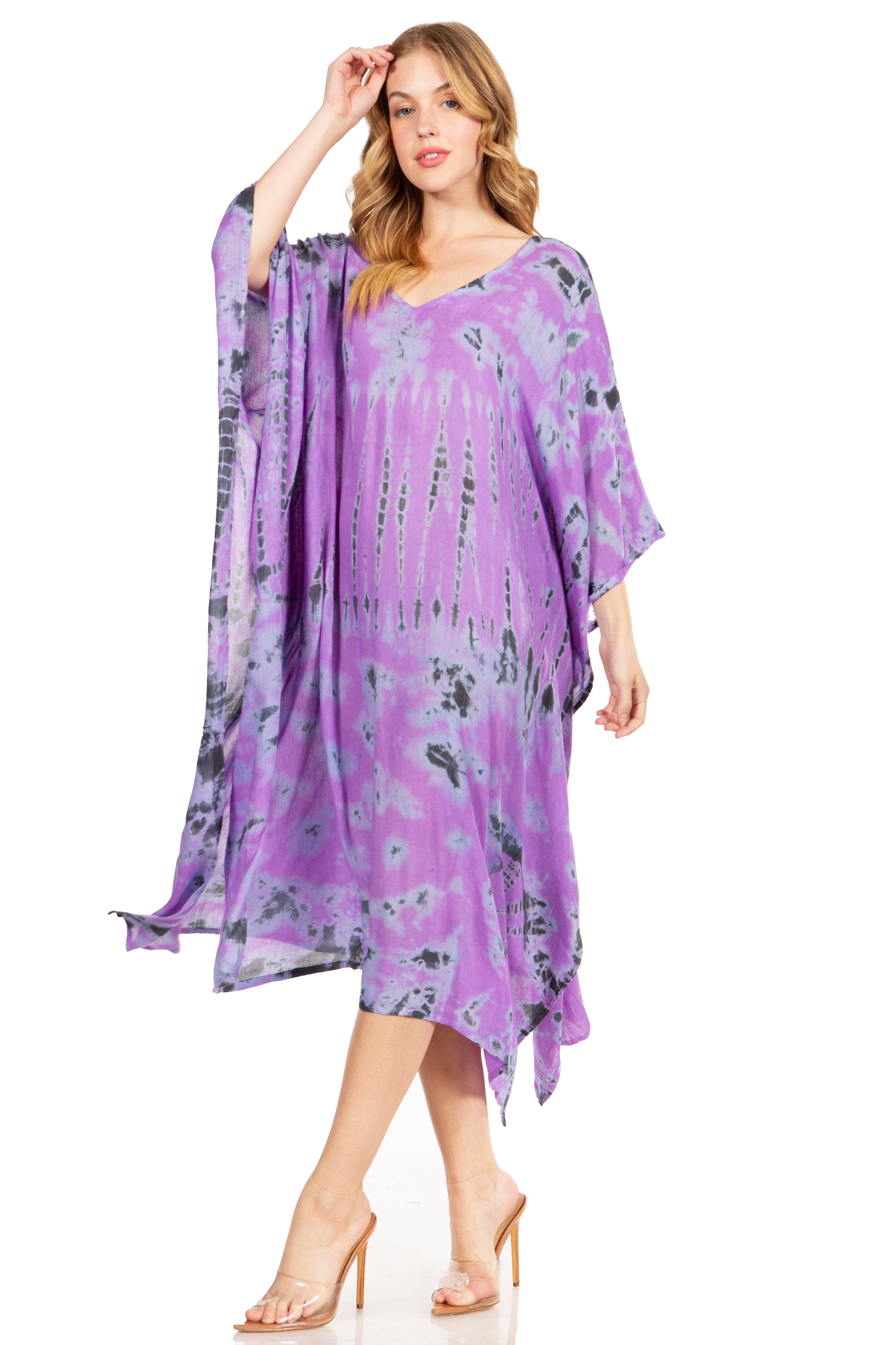 Woman wearing a purple floral dress on a white background