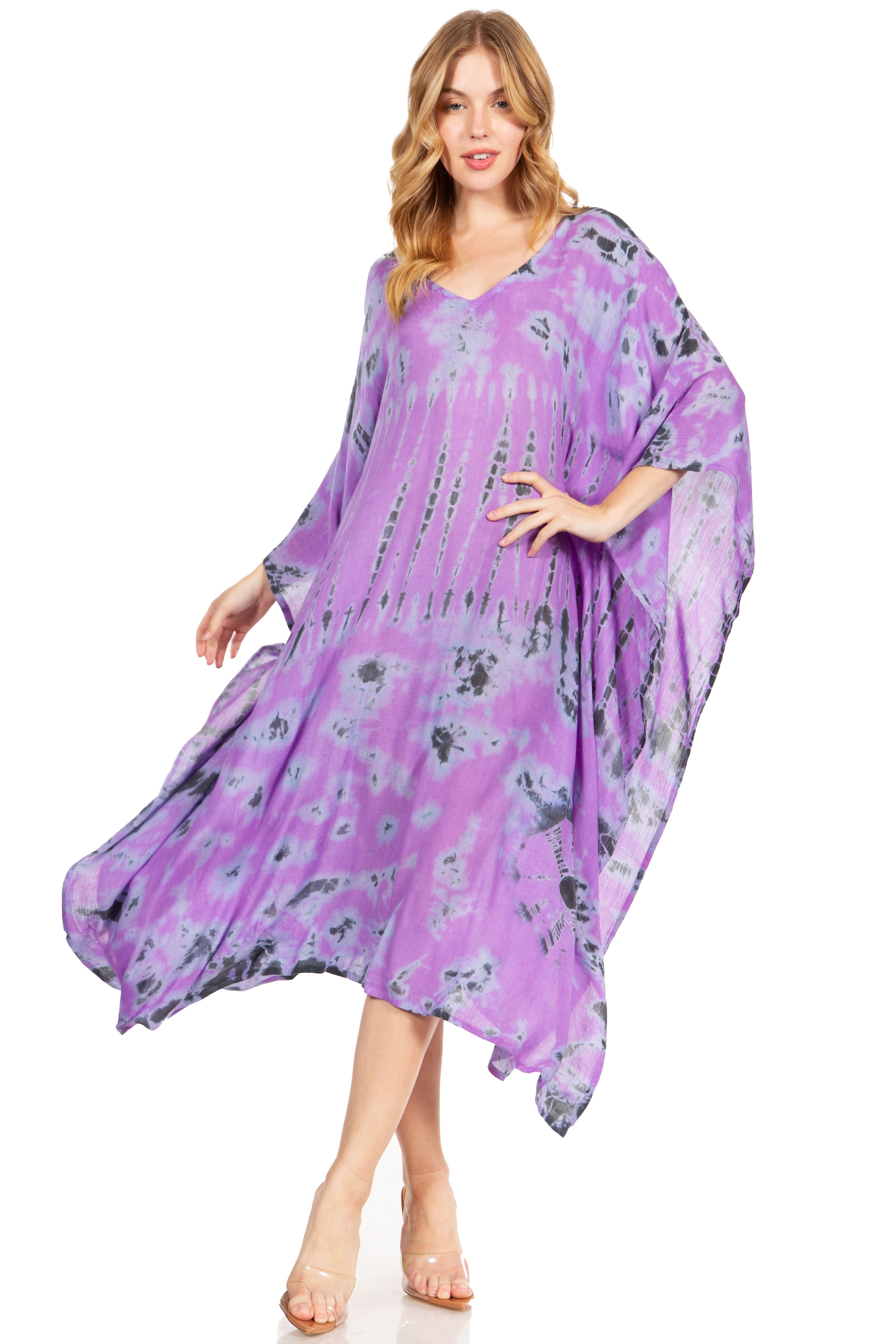 Woman wearing a purple floral dress on a white background