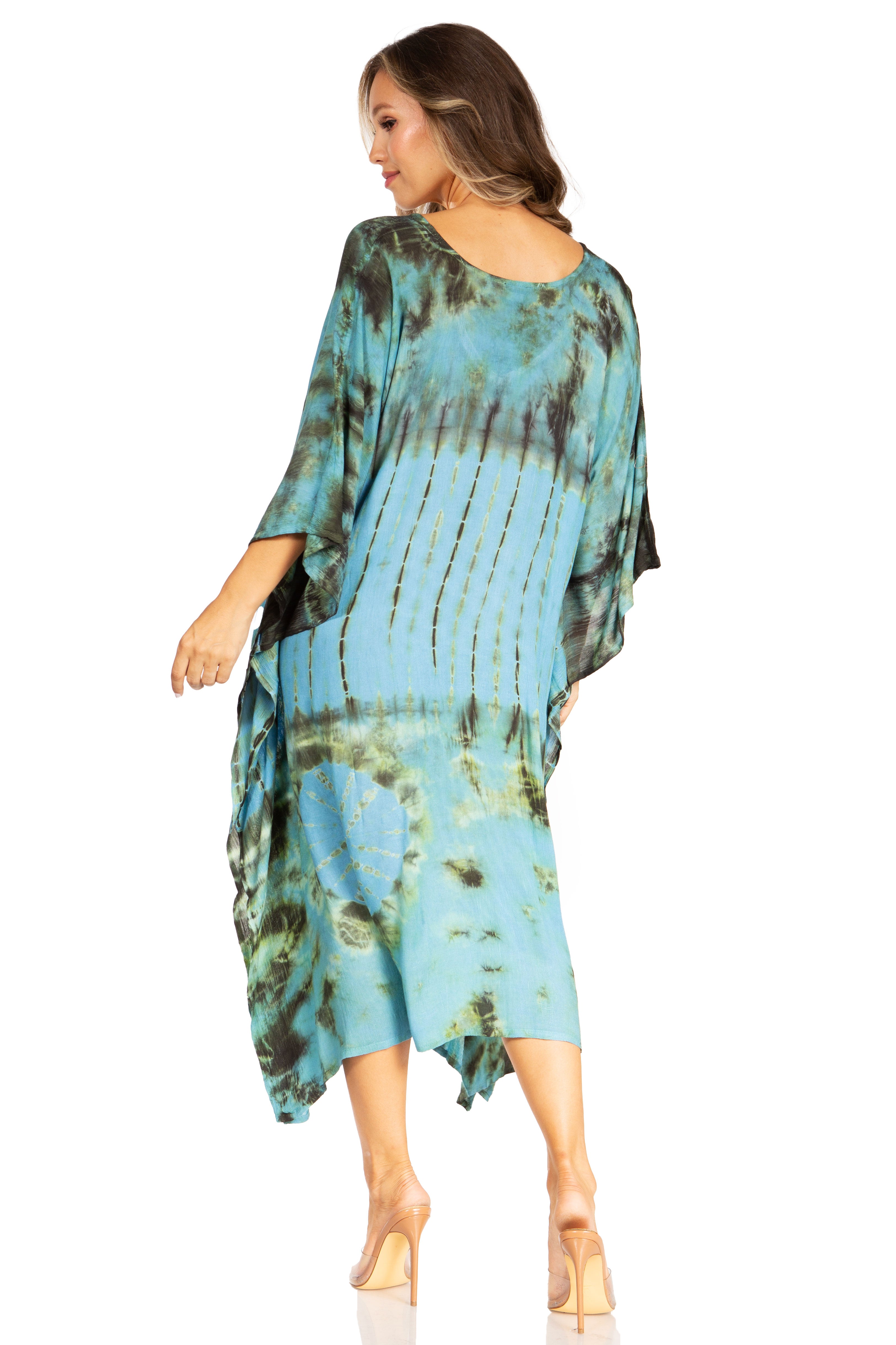 Woman wearing a tie-dye dress with a white background