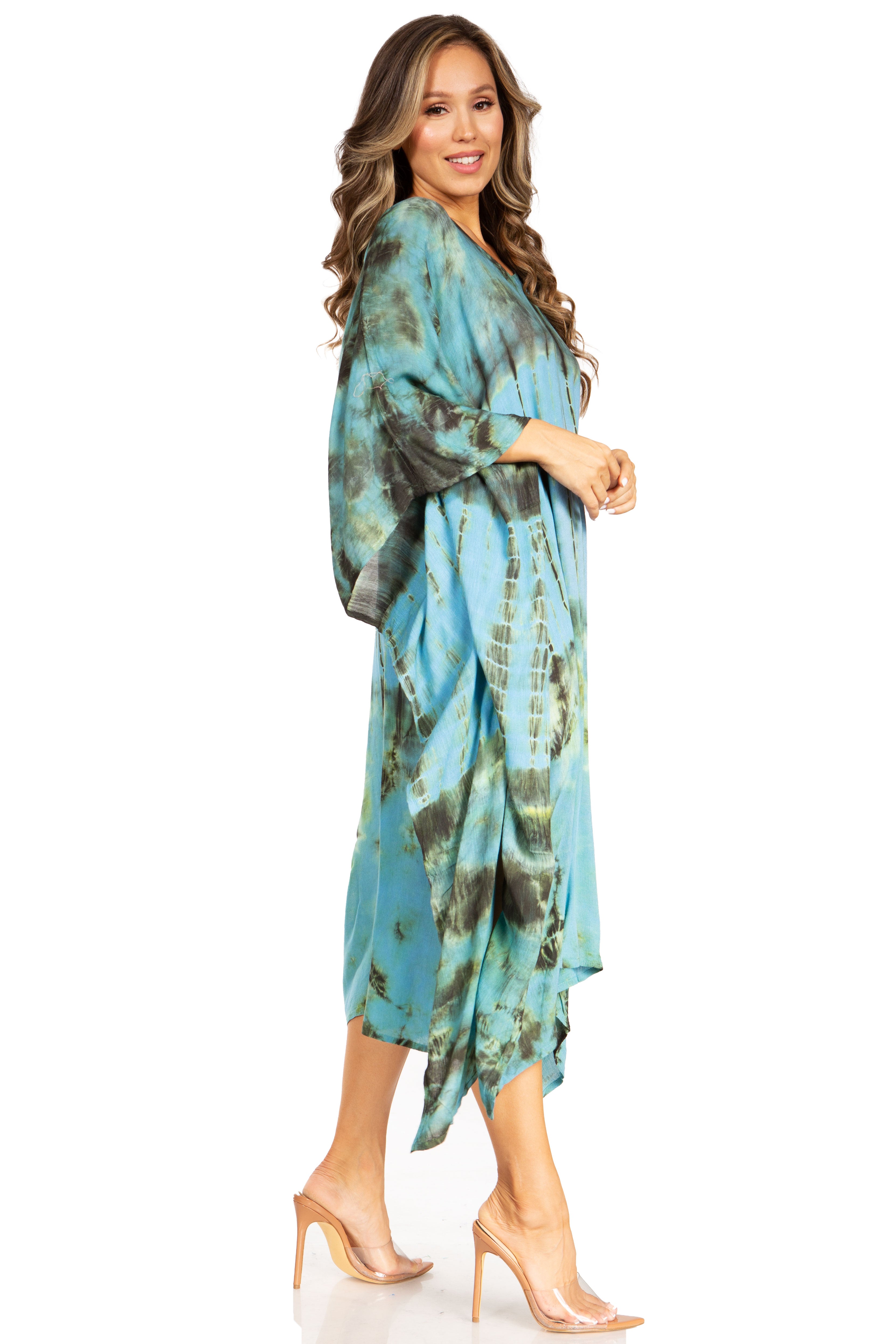 Woman wearing a blue tie-dye dress on a white background
