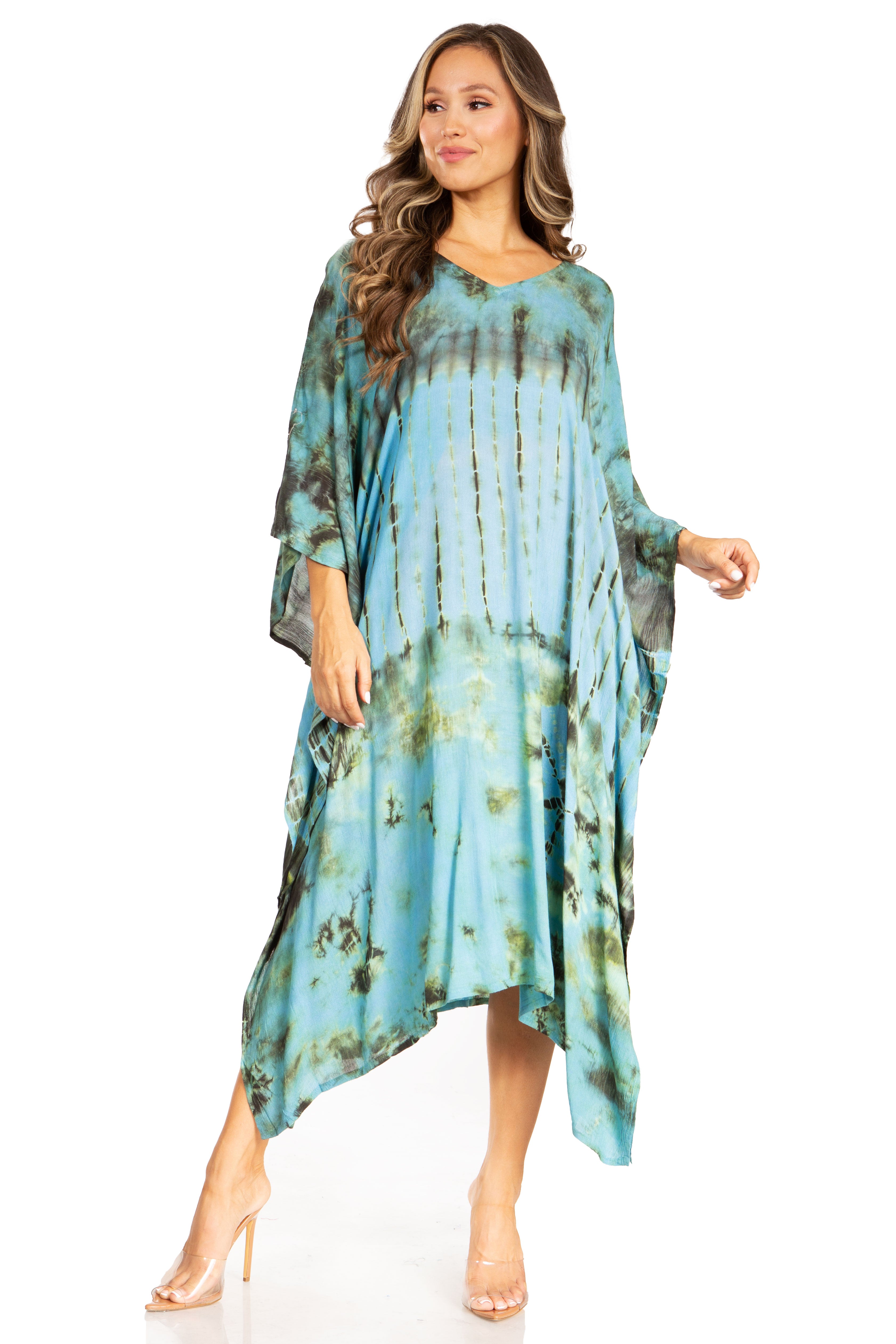Woman wearing a blue tie-dye dress on a white background