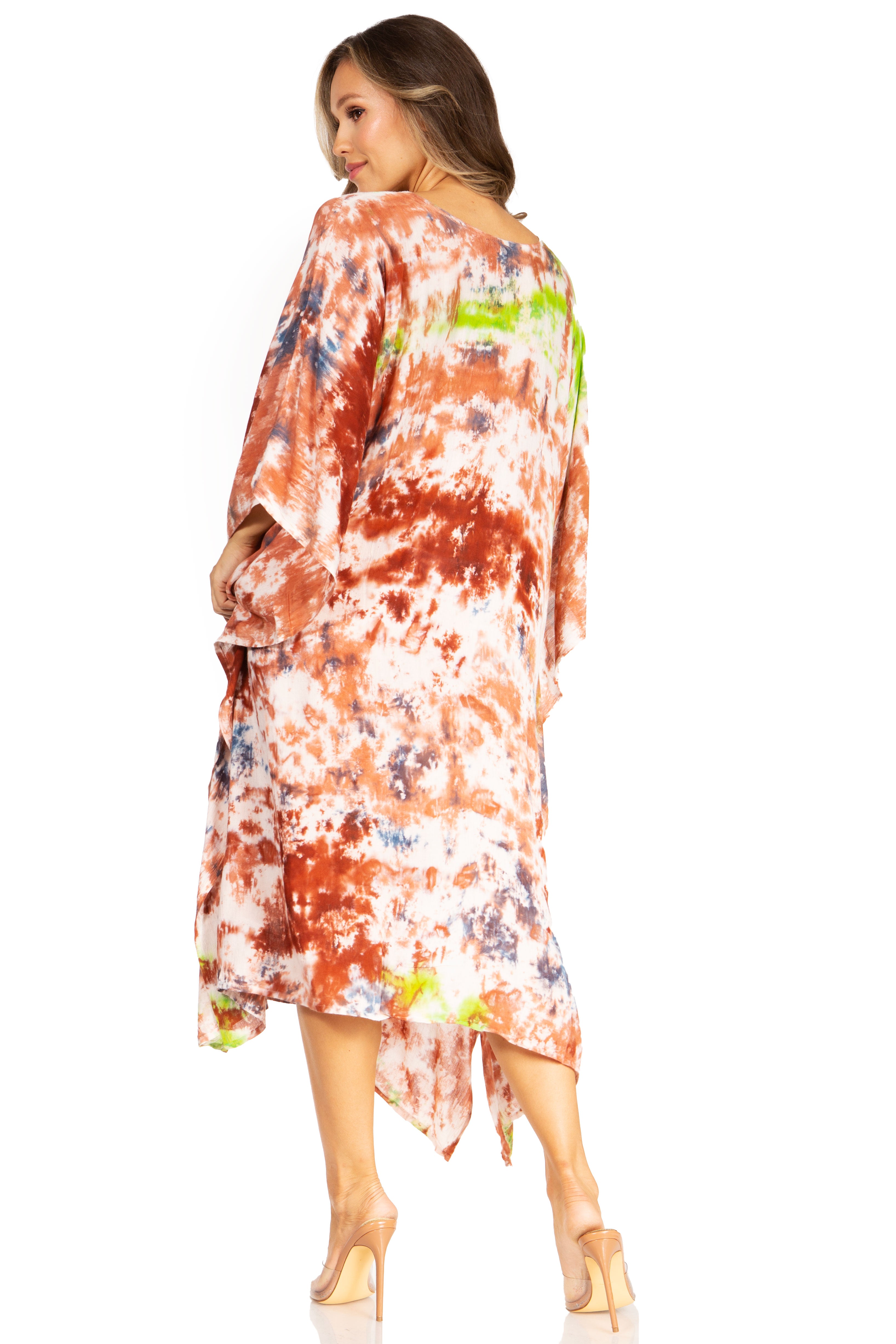 Woman wearing a colorful tie-dye dress on a white background
